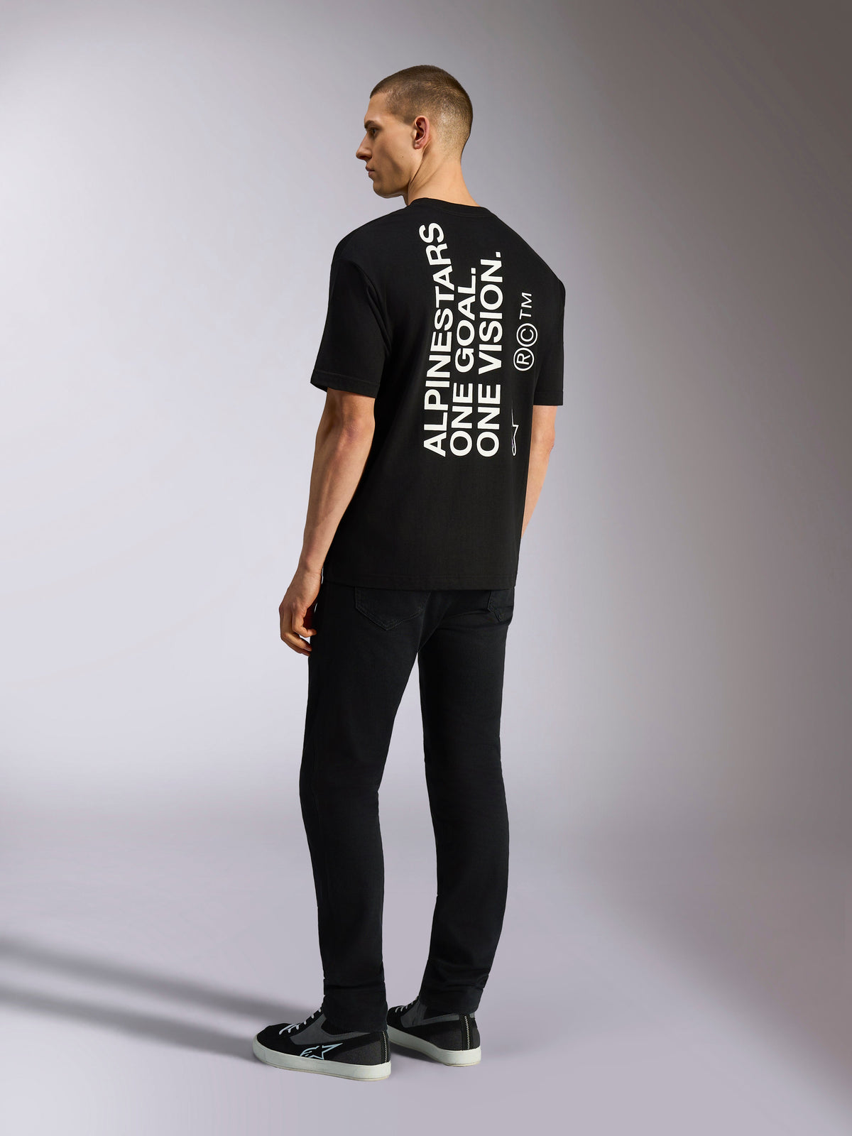 Alpinestars One Oversized CSF Tee, Short Sleeve T-Shirt, Black, back view with vertical white 'ALPINESTARS ONE GOAL. ONE VISION.' graphic, oversized fit, casual motorsport-inspired streetwear