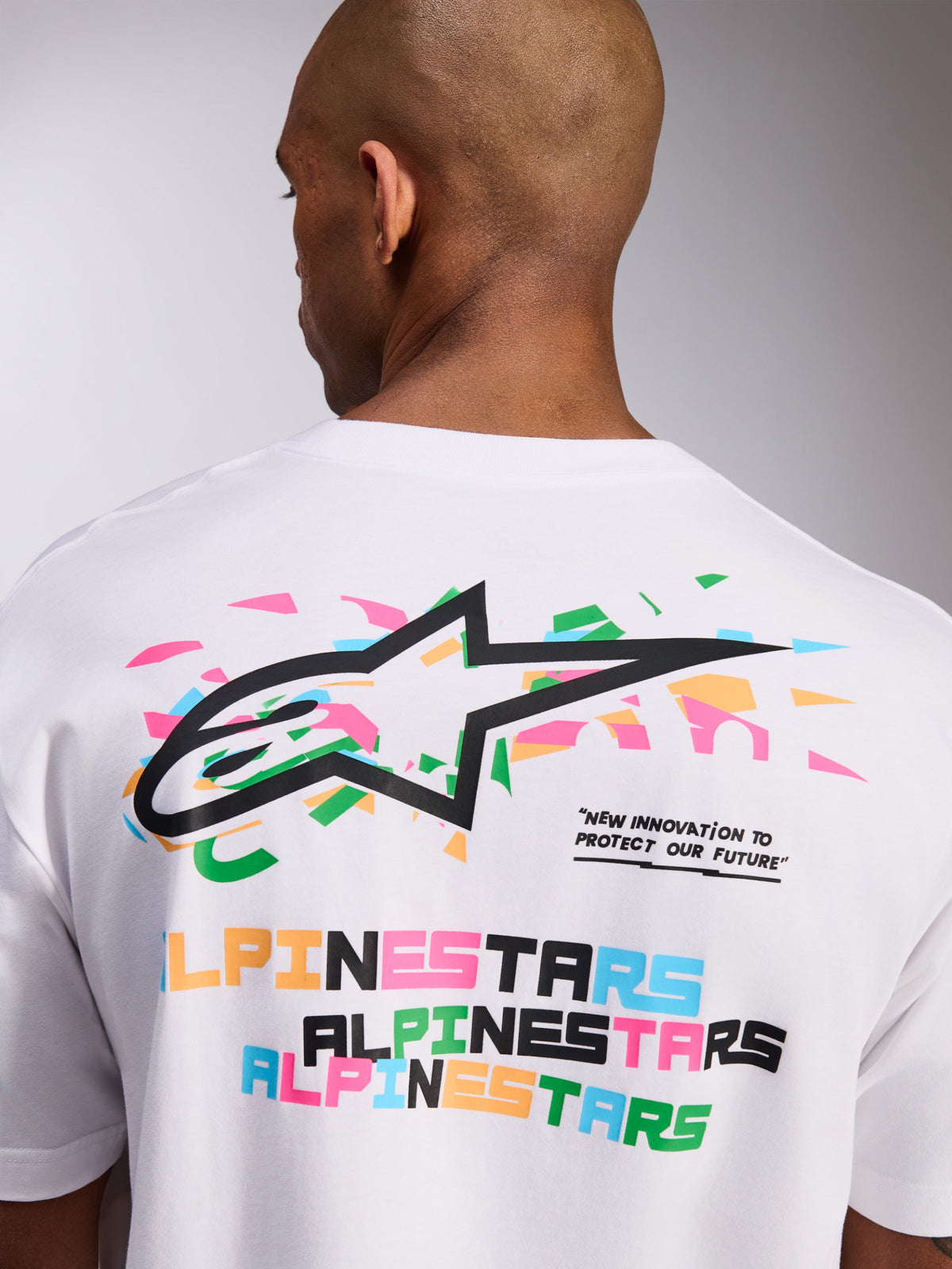 Alpinestars Wild Oversized CSF Tee, Short Sleeve T-Shirt, White, Back Graphic with Vibrant Multi-Color Astars Logo and Slogan Text, Casual Sportswear