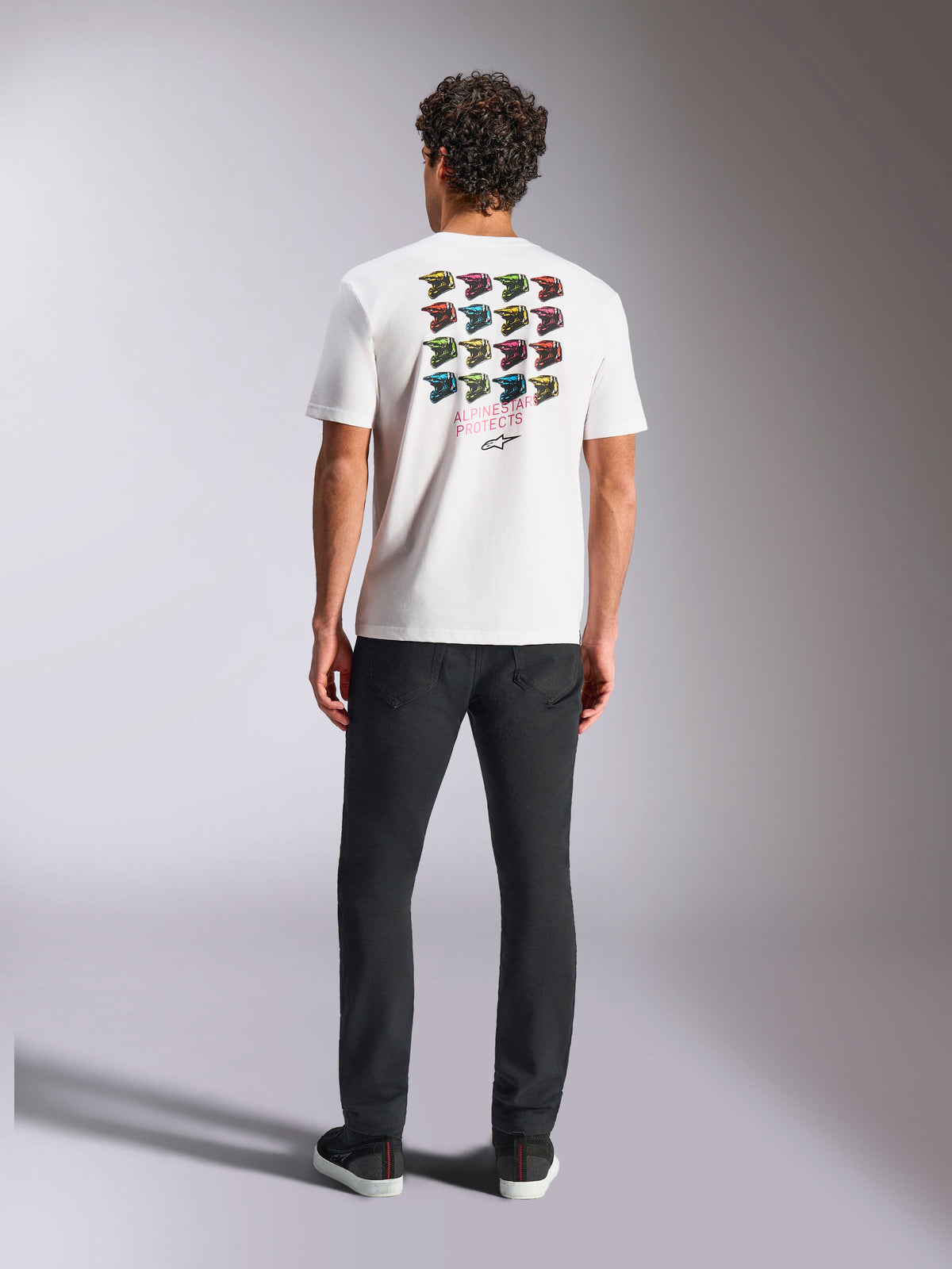 Alpinestars Pop Helmet CSF Tee, Short Sleeve T-Shirt, White, featuring a colorful M10 helmet grid graphic on the back with Alpinestars Protects text, casual motorsport streetwear