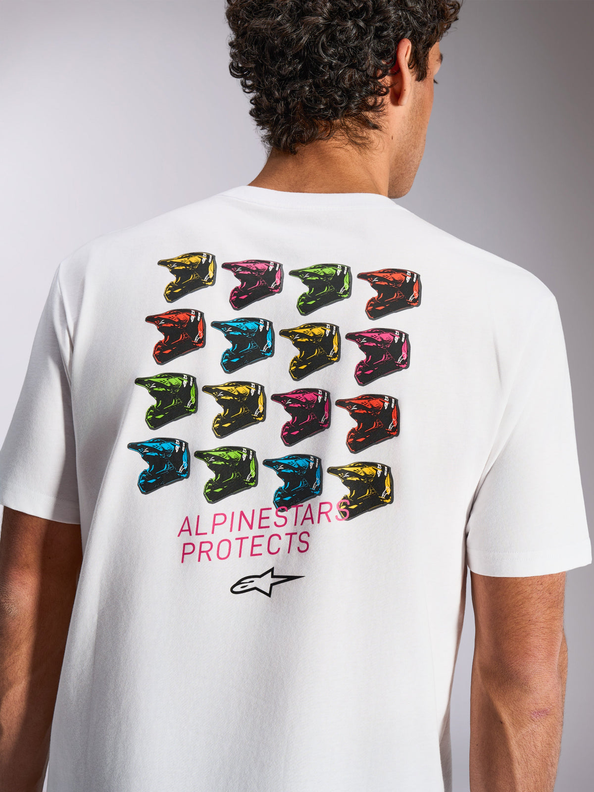Alpinestars Pop Helmet CSF Tee, Short Sleeve T-Shirt, White, Back Graphic with Colorful M10 Helmet Grid, 'ALPINESTARS PROTECTS' Text and Astars Logo, Casual Motorsport Sportswear