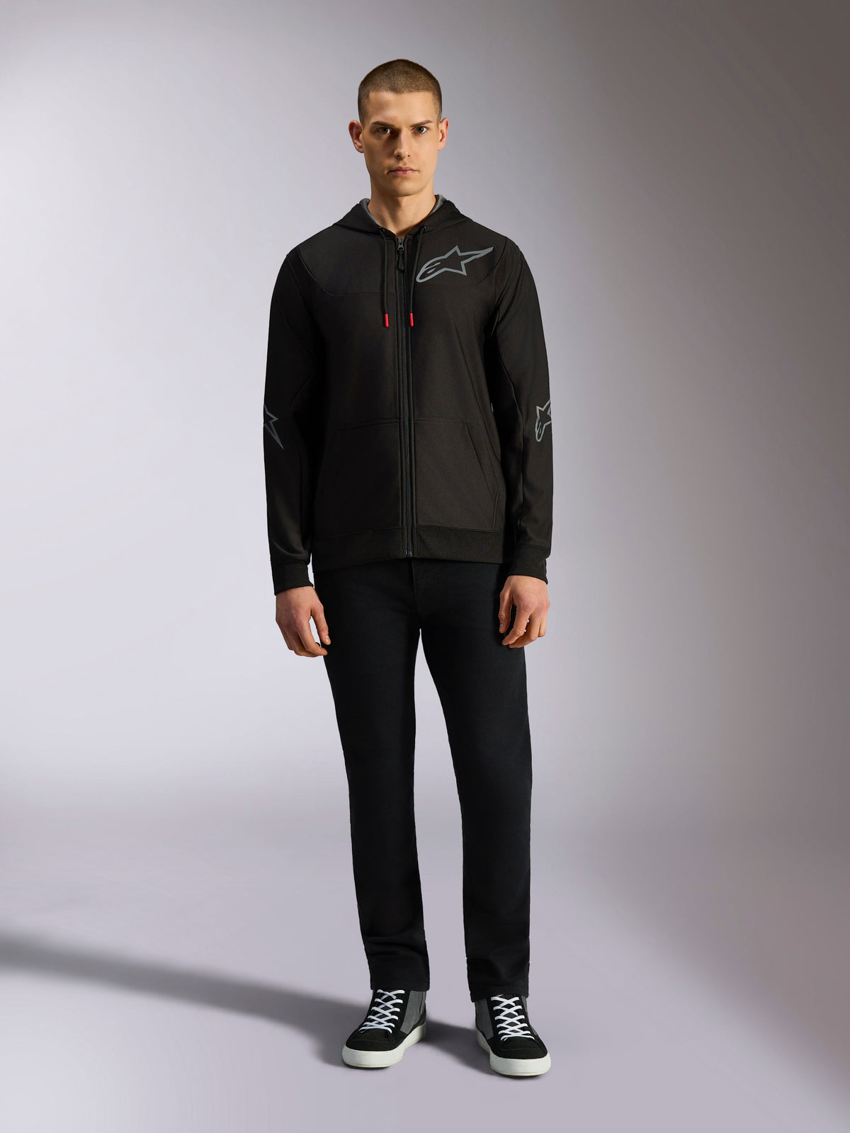 Alpinestars Sessions V3 Hoodie, zip-front fleece hoodie, Black with grey Astars logo on the chest and sleeves, red-tipped drawcords, casual motorsport-inspired streetwear.