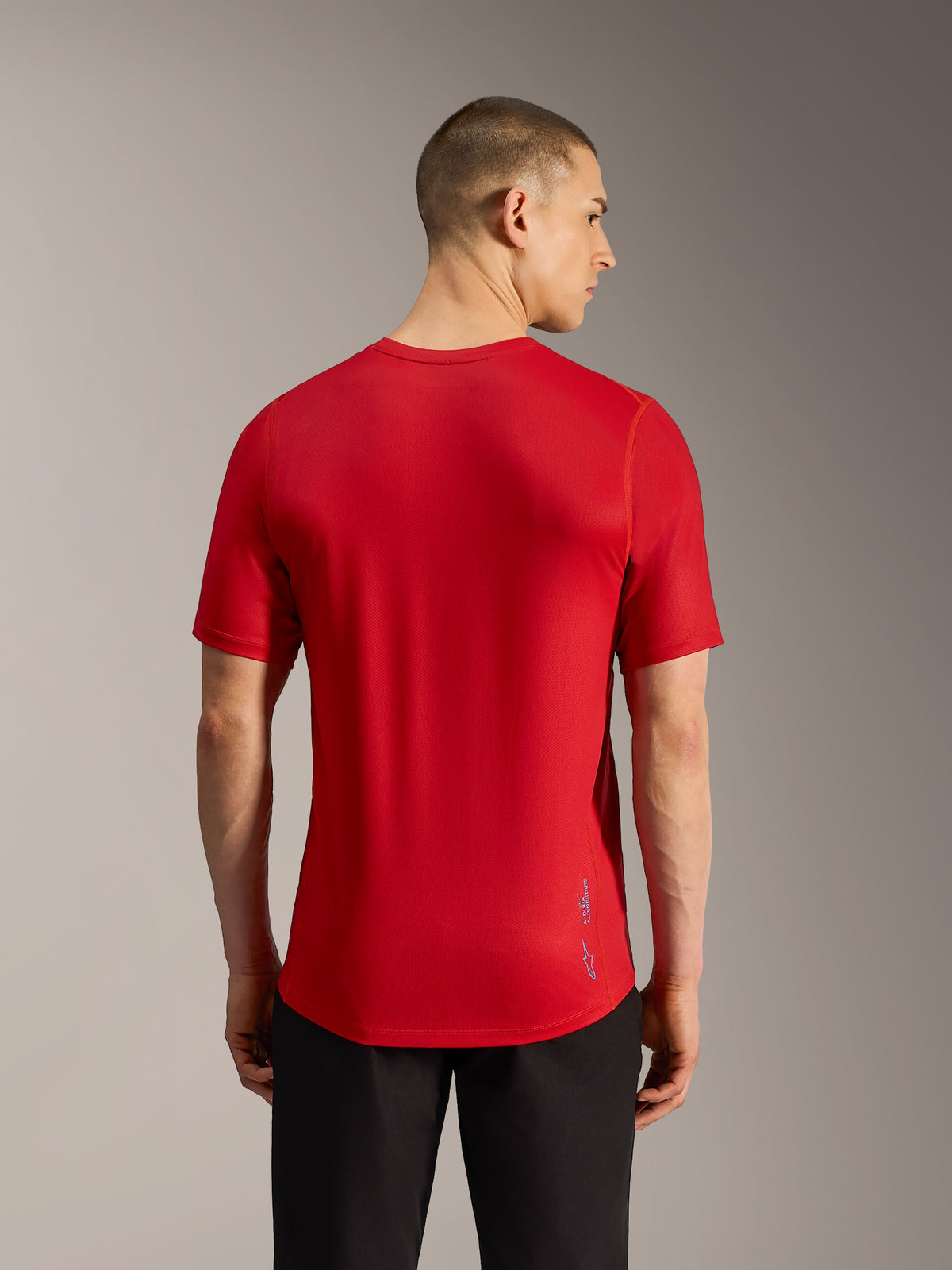 Red A-Dura Ride Short Sleeve MTB Jersey, back view with performance jacquard fabric, dropped tail, and subtle logo branding.