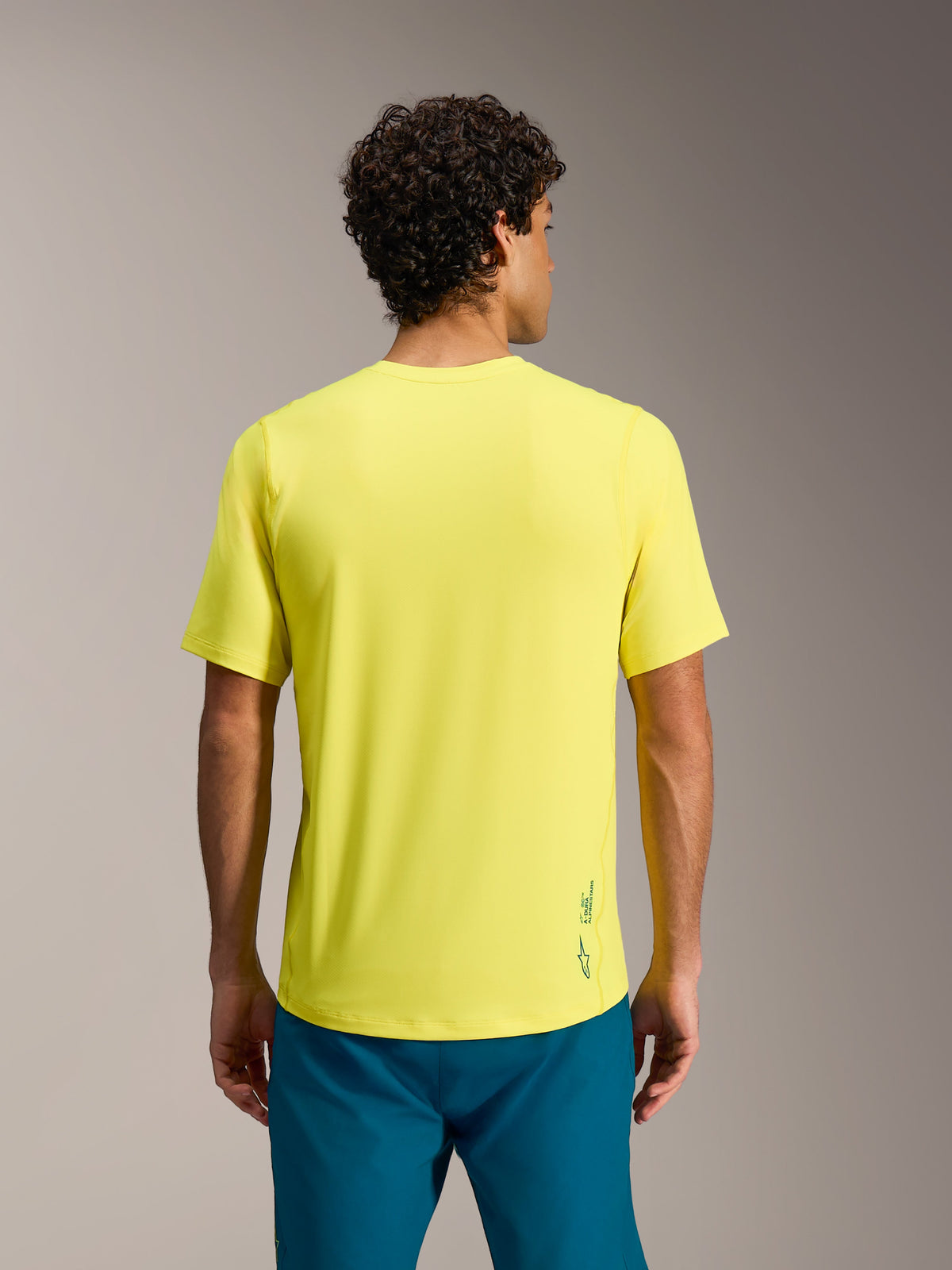 A-Dura Ride Trikot in Yellow Fluo, kurze Ärmel, reguläre Passform und Astars-Branding am unteren Rücken, Rückansicht.