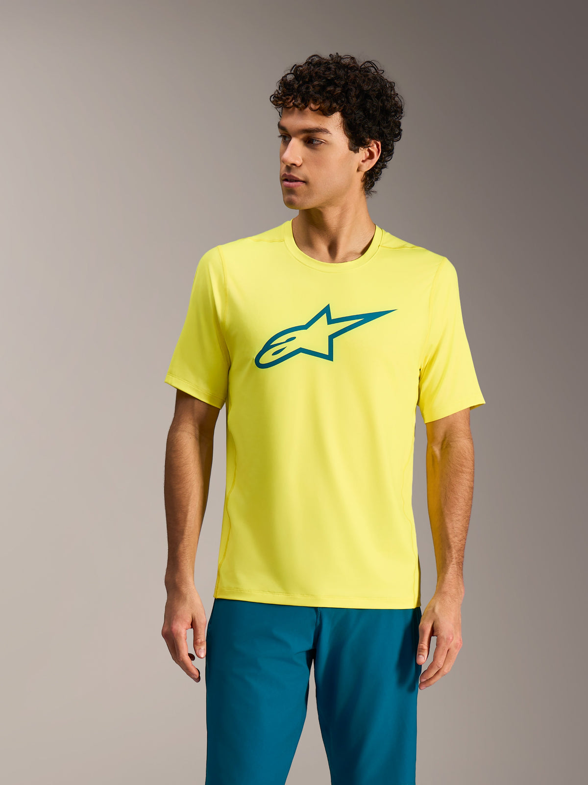 Alpinestars A-Dura Ride Trikot in Yellow Fluo, Kurzarm-MTB-Top mit petrolfarbenem Logo, Performance-Radbekleidung.