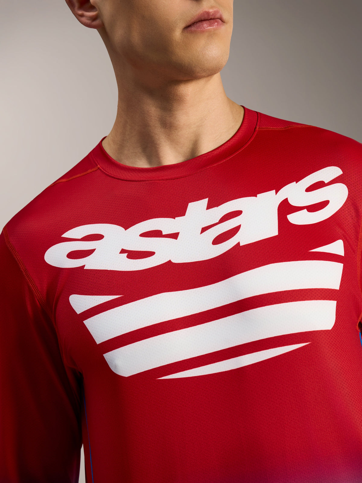 Alpinestars A-Dura ASTARS 2.0 Langarm-MTB-Trikot in Hellrot mit weißem Brustlogo und Streifengrafiken.