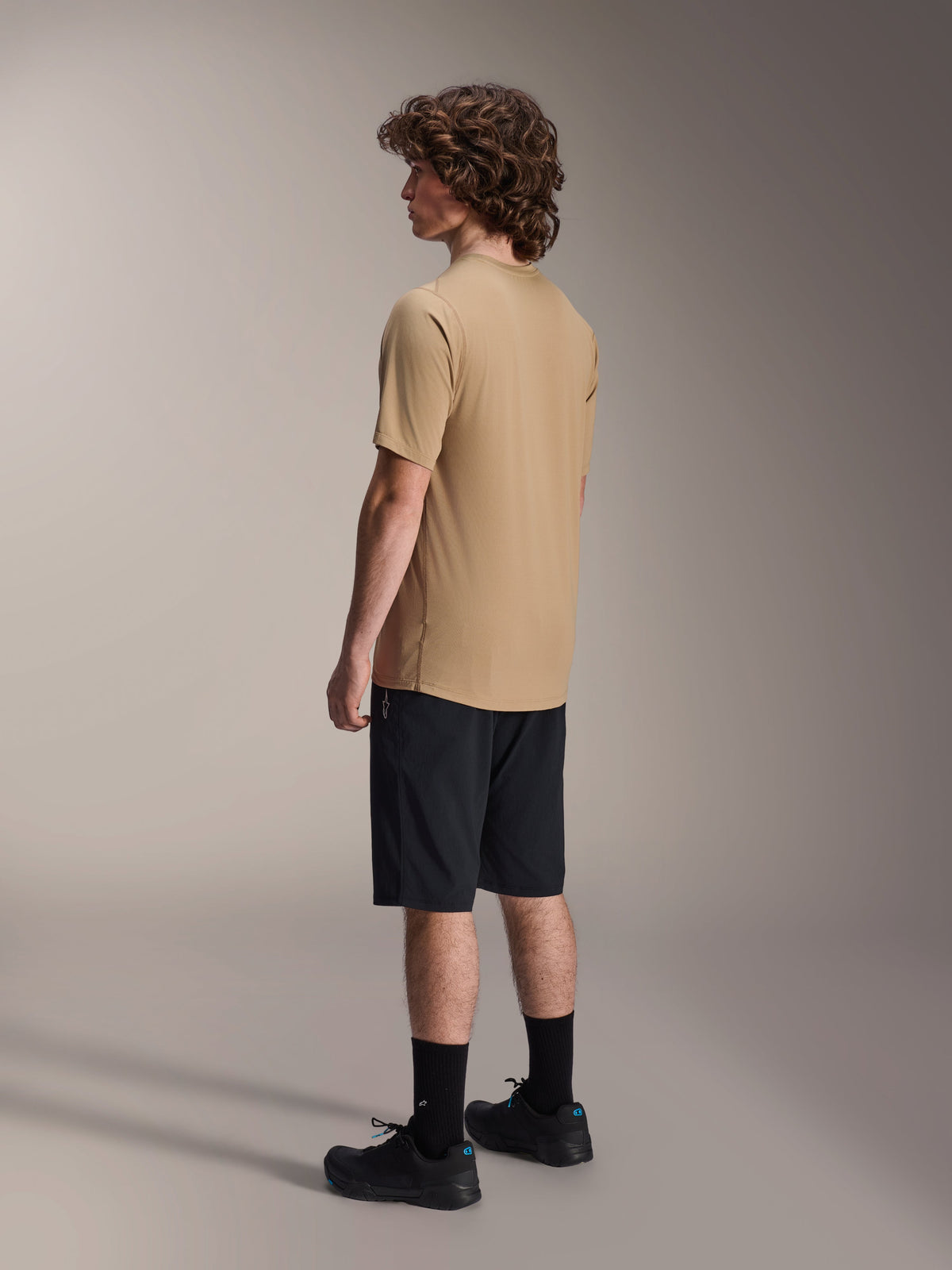 Alpinestars A-Dura Astar Short Sleeve Jersey, Light Brown, worn with black shorts and black socks, jacquard moisture-wicking fabric, casual mountain bike performance apparel