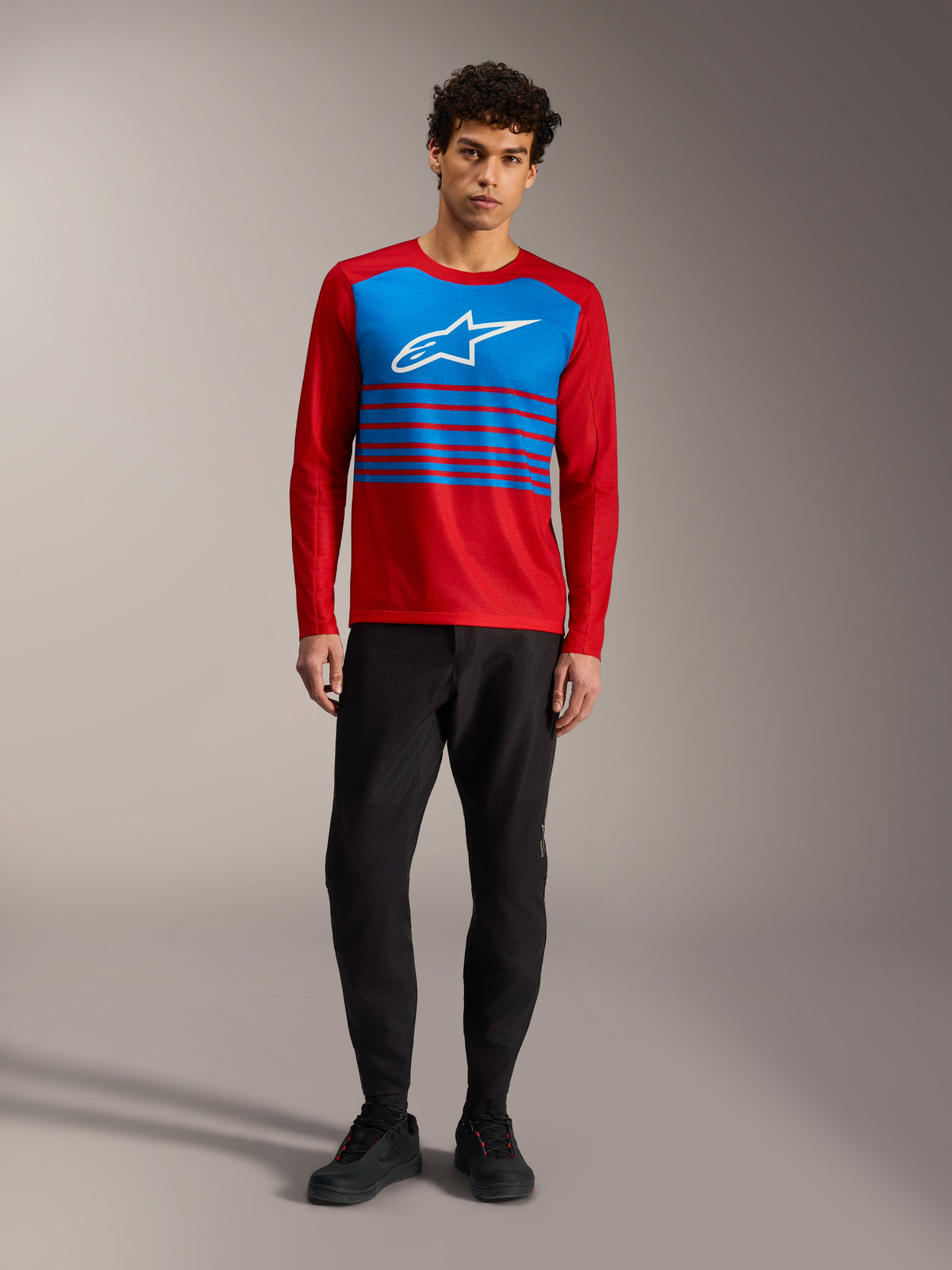 A-Dura Elite Jersey 2.0, red long sleeve MTB top with blue chest panel, white Alpinestars logo, and striped accents.