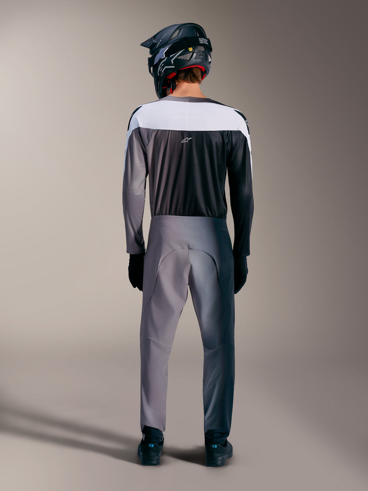 Rear view of A-Supra Elite Jersey and Pants in Faded Gray, featuring premium MTB racing fabrics and Astars branding.