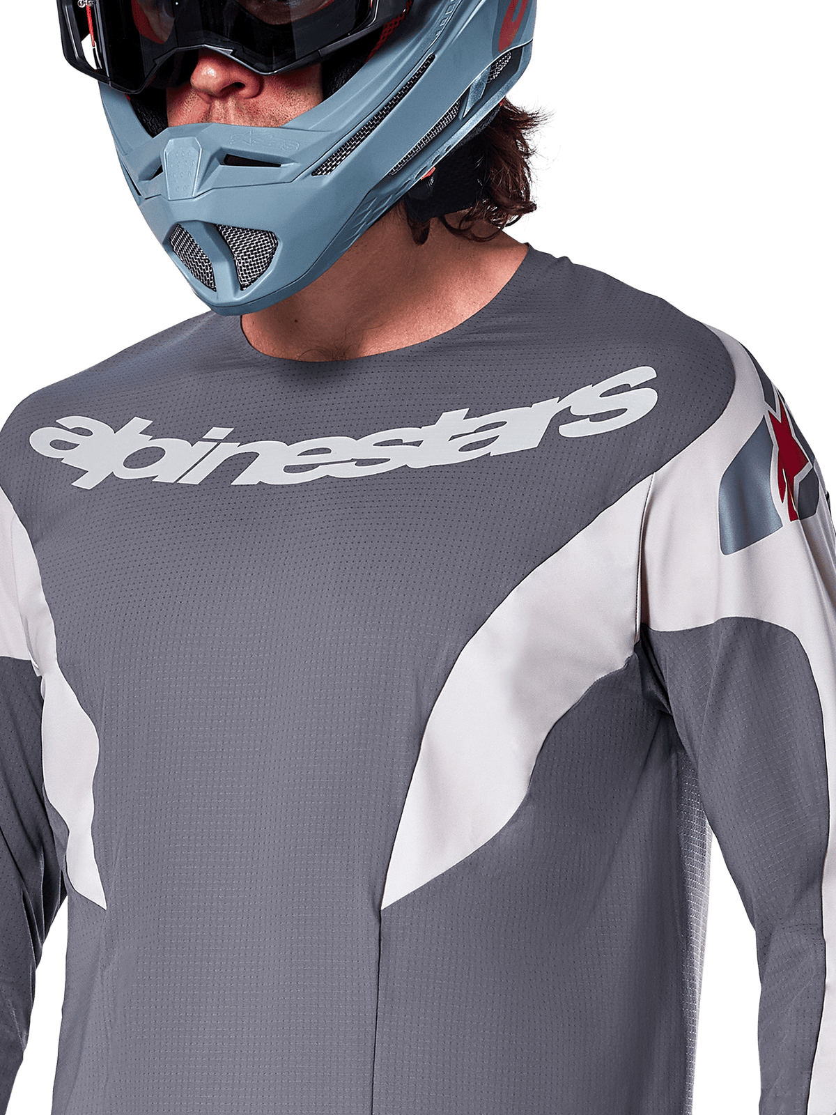 Alpinestars A-Supra Race Jersey - Long Sleeve, MTB Jersey, Dark Gray with white racing graphics and white Alpinestars logo, worn with a light blue full-face helmet and goggles, micro-perforated fabric for off-road performance