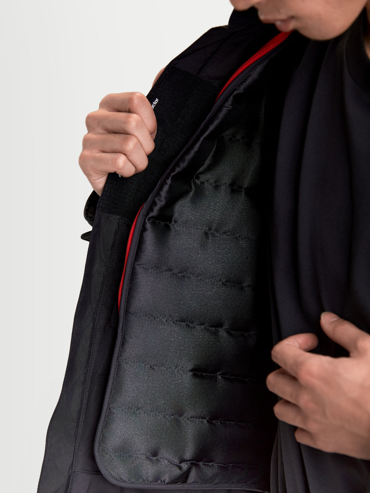 Alpinestars Revern Leather Jacket, urban motorcycle jacket in black, close-up view showing the removable quilted thermal vest insulation lining and red inner zipper detail