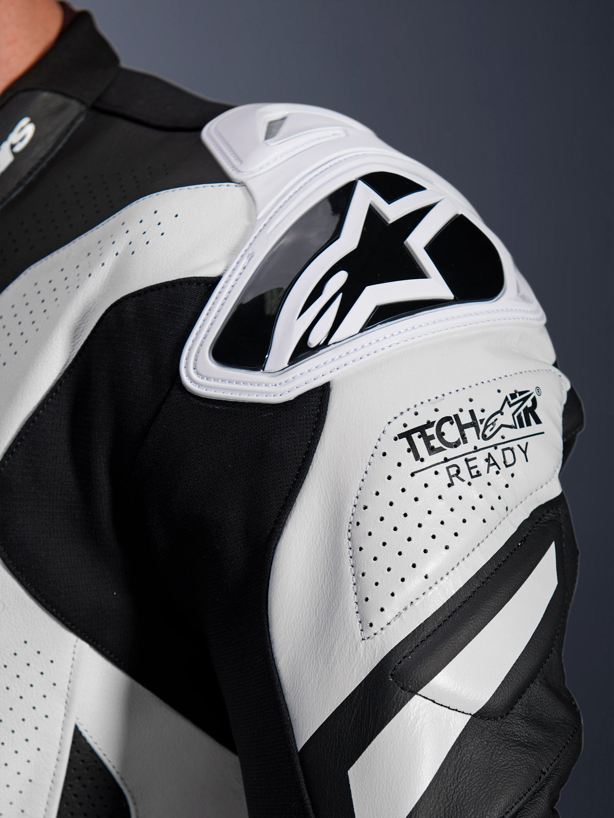 Alpinestars GP Plus V4 Sprint Leather Suit shoulder armor, black and white perforated leather with Tech-Air Ready logo.