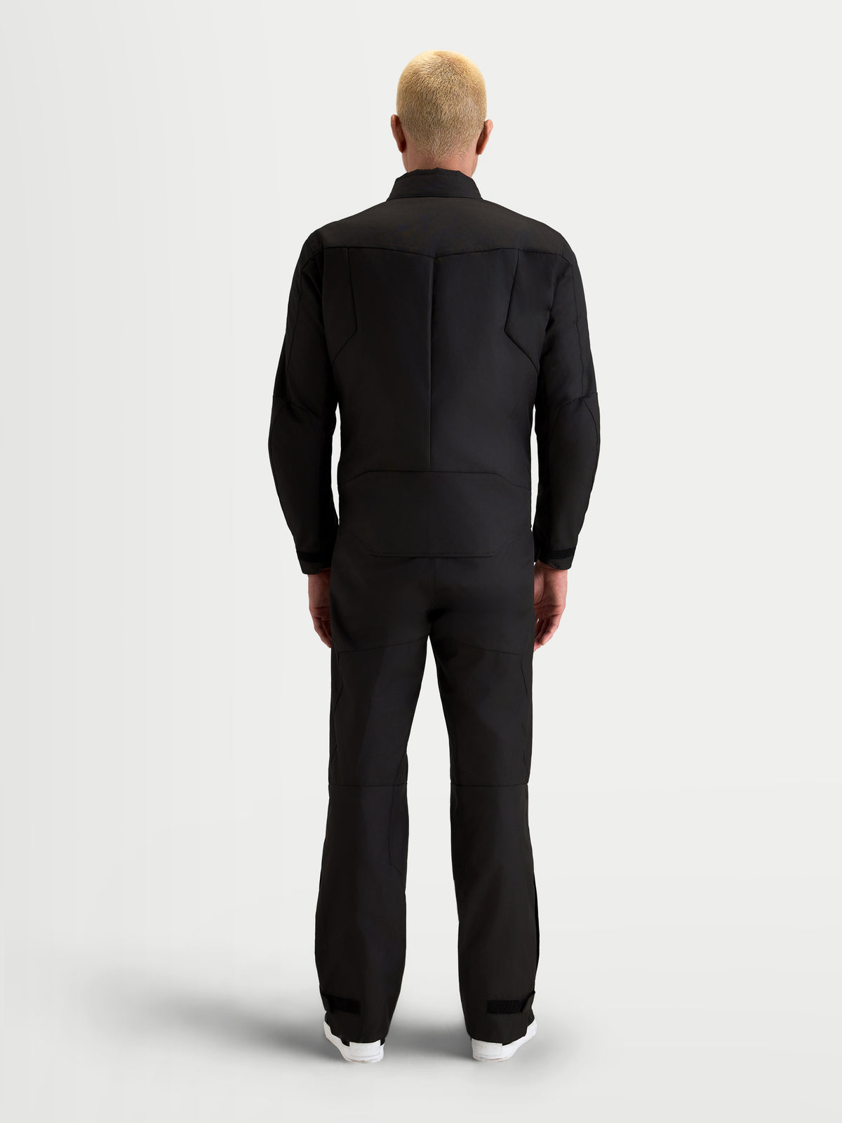 Alpinestars C-1 Waterproof Jacket, men's urban contemporary motorcycle textile jacket in black, rear view on a model showing the ergonomic 3D back pattern and polyfabric construction.