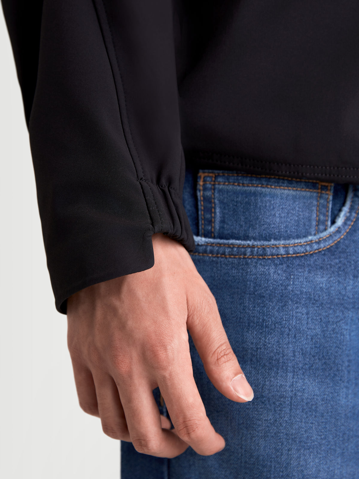 Alpinestars C-5 Drystar Jacket, men's urban motorcycle textile jacket, black, close-up view of elasticated cuff detail worn by a model in blue jeans