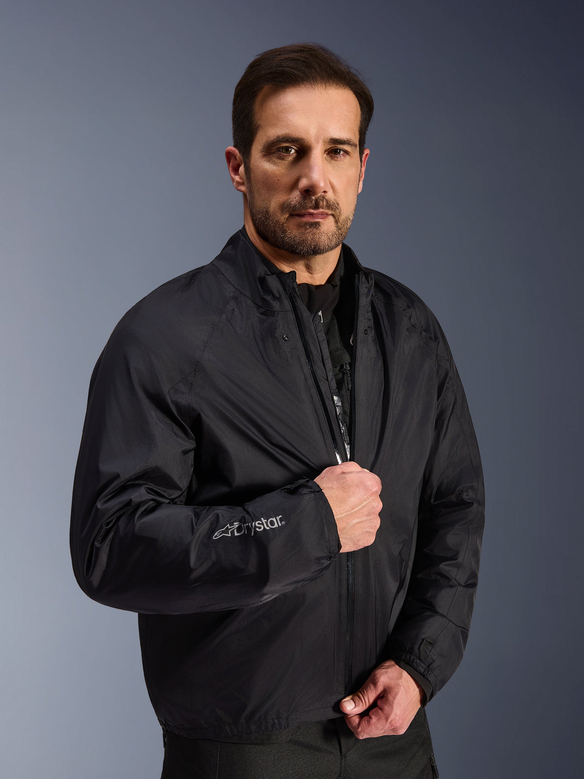 Alpinestars Cusco Drystar® Jacket, Black waterproof adventure touring gear worn by a male model.