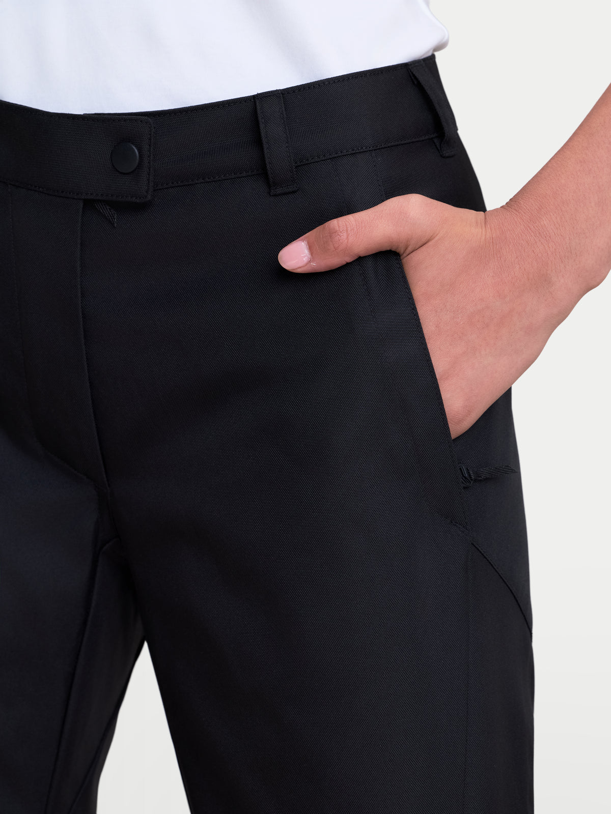 Alpinestars Stella C-1 Waterproof Pants, women's urban motorcycle pants in black, close-up view highlighting the belt loop design and zippered front pocket construction worn on a model