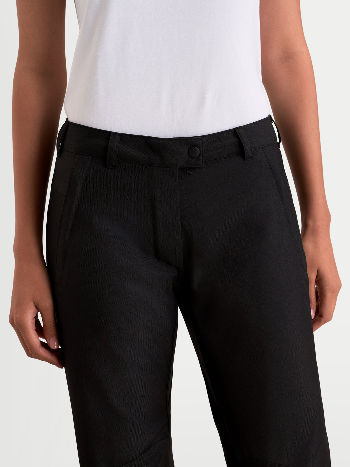 Alpinestars Stella C-1 Waterproof Pants, women's urban contemporary motorcycle pants in black, close-up view focusing on the waist and belt loop design worn by a model