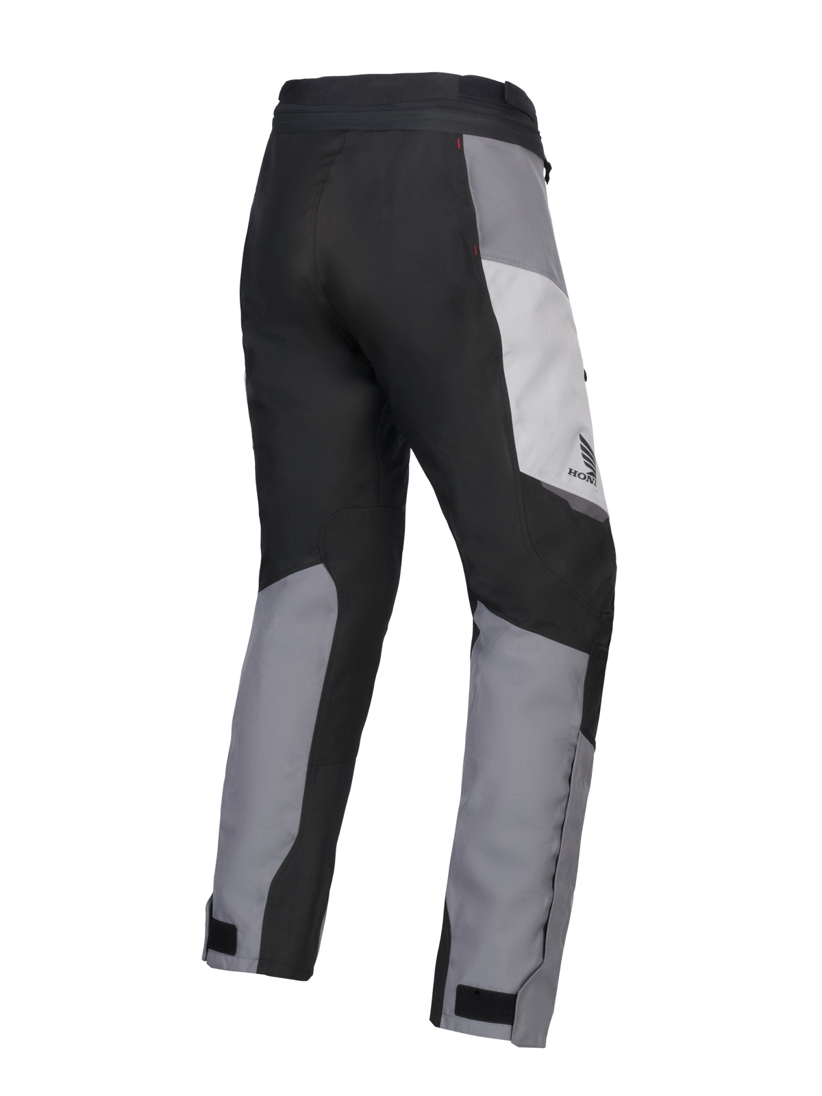 Alpinestars 2025 Honda Stella ST-1 Waterproof Damen-Motorradhose, Damen-Motorrad-Touringhose, Ice Gray, Dunkelgrau und Schwarz, Rückansicht in Dreiviertel-Perspektive zeigt strapazierfähige Textilkonstruktion, grau und schwarz farblich abgesetzte Paneele, Honda-Branding an der Hüfte und verstellbare Knöchelverschlüsse.