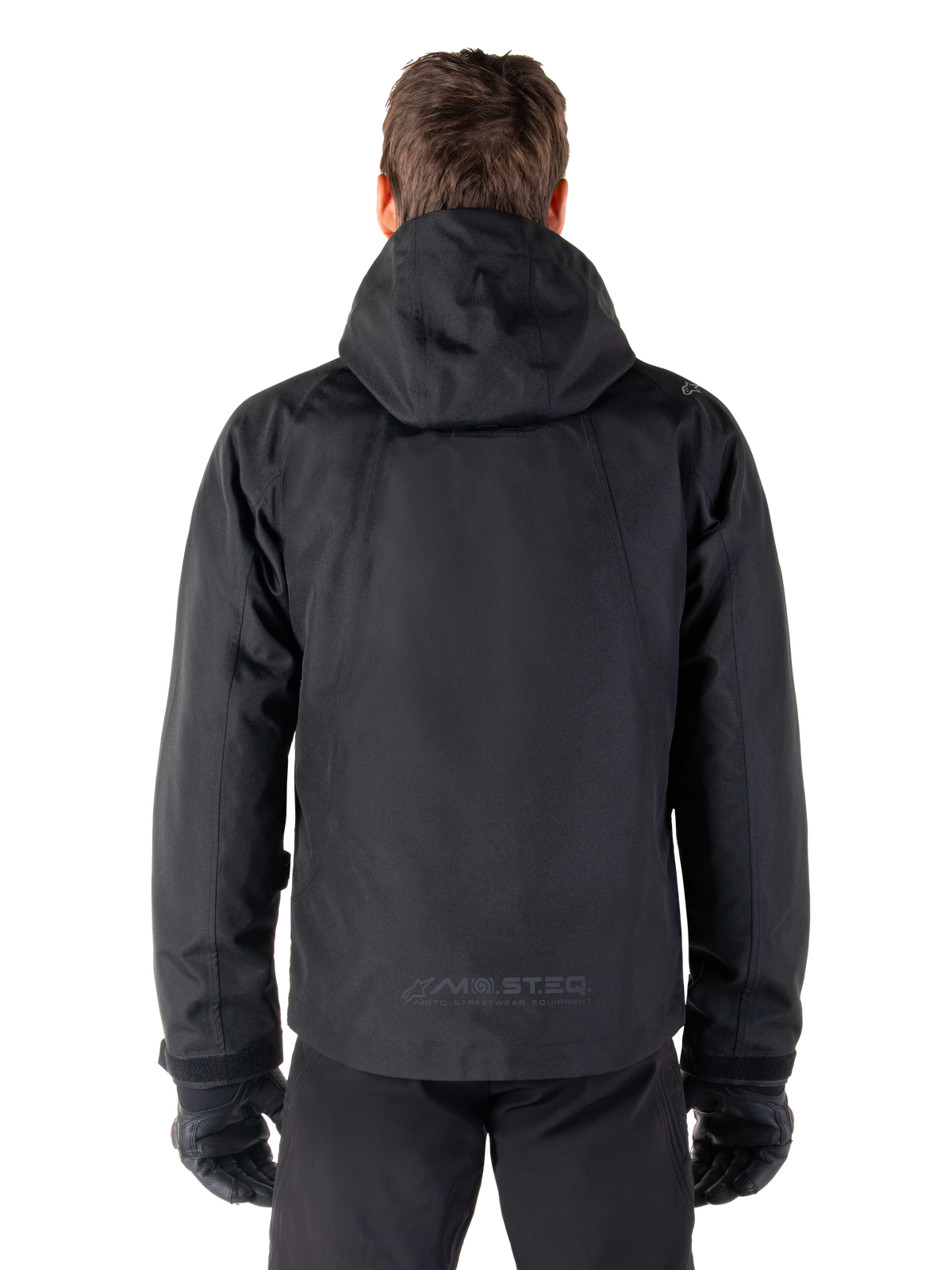 Alpinestars Morush Wasserdicht Parka, schwarze Herren-Motorradjacke, Rückansicht mit Kapuze und reflektierendem MO.ST.EQ. Logo.