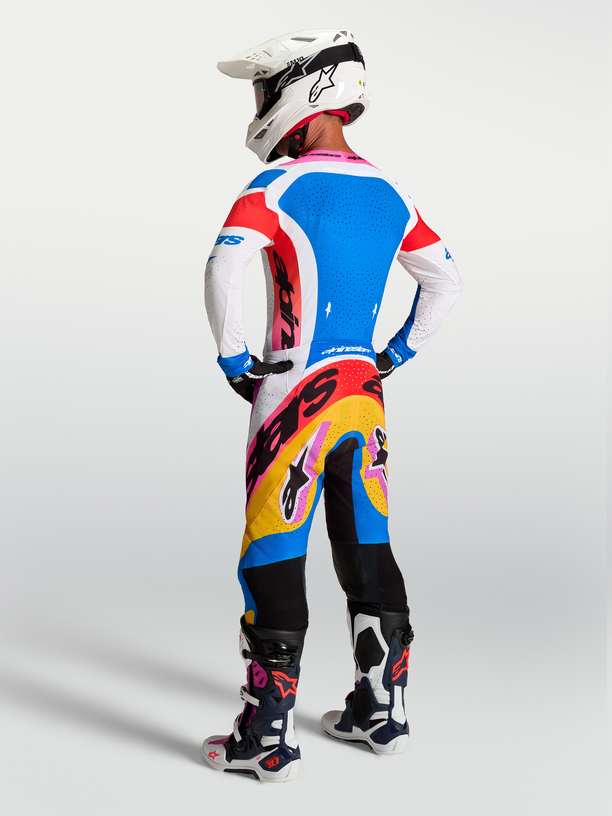 Alpinestars 2027 Supertech Dyna Pants, White and Blue Motocross racing gear with vibrant graphics, on-model rear view.