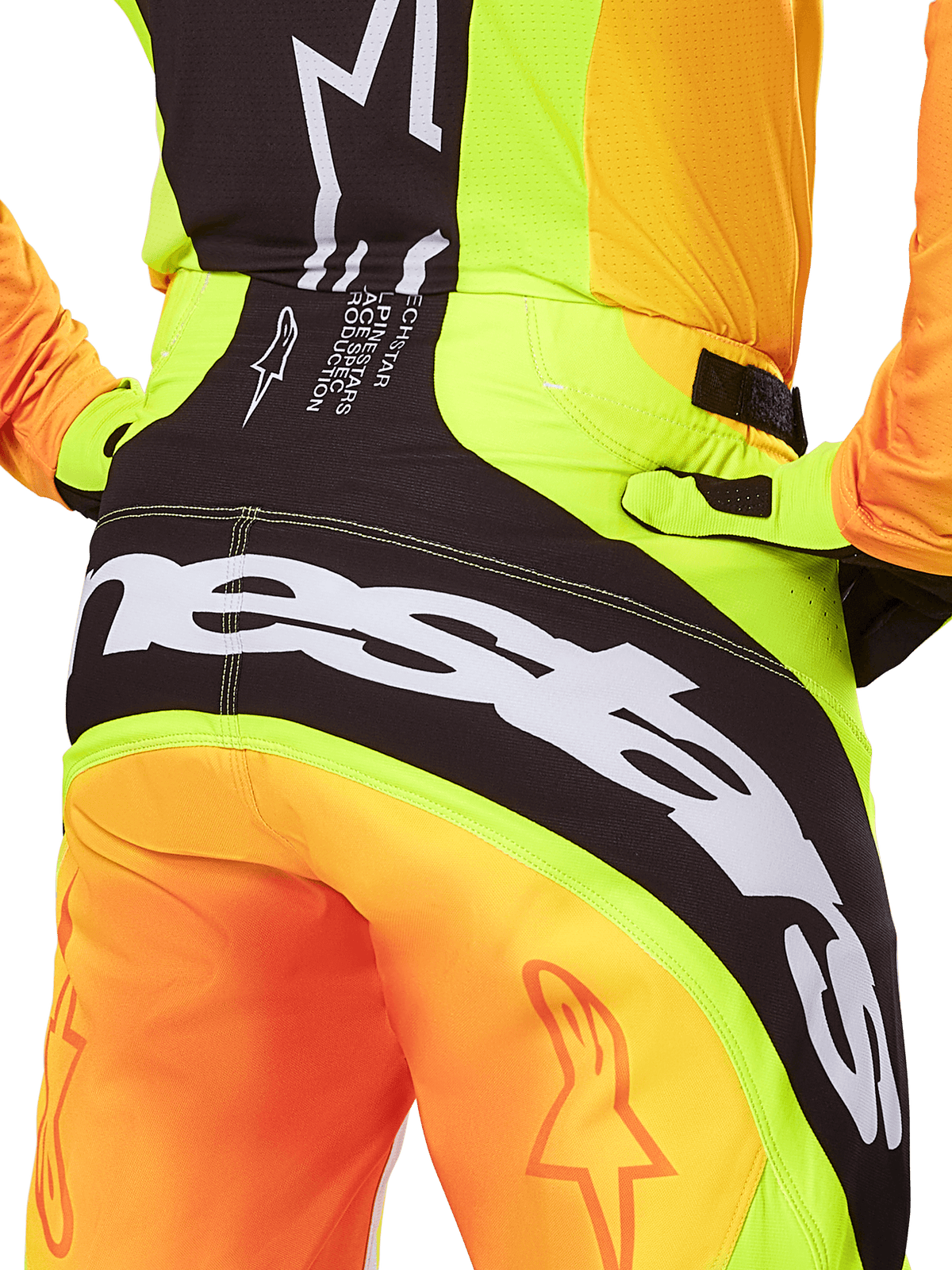 Alpinestars 2025 Techstar Melt Hose, Motocross-Hose, Rückansicht im Detail, Neongelb und Orange mit schwarzen Paneelen, großes weißes Alpinestars-Logo auf dem Gesäß, Performance-Offroad-Ausrüstung