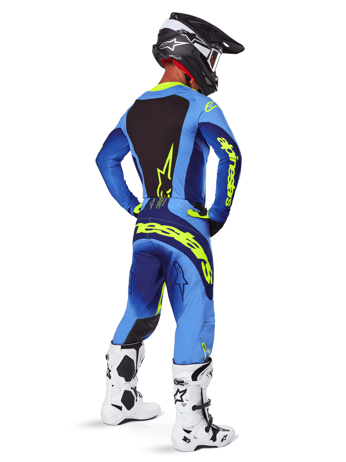 Alpinestars 2025 Techstar Melt Hose, Motocross-Ausrüstung, Gelb Fluo Blau, Rückansicht eines Fahrers in passendem blauem Trikot mit großem gelbem Branding, weißen und schwarzen Stiefeln und schwarzem Helm, koordiniertes Rennoutfit für Offroad-Performance