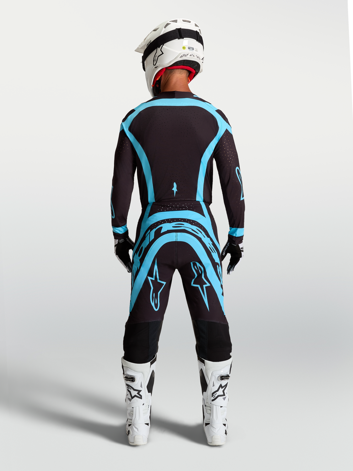 Alpinestars Supertech Vesta Pants in Black and Turquoise, pro-level motocross gear with an athletic performance fit.
