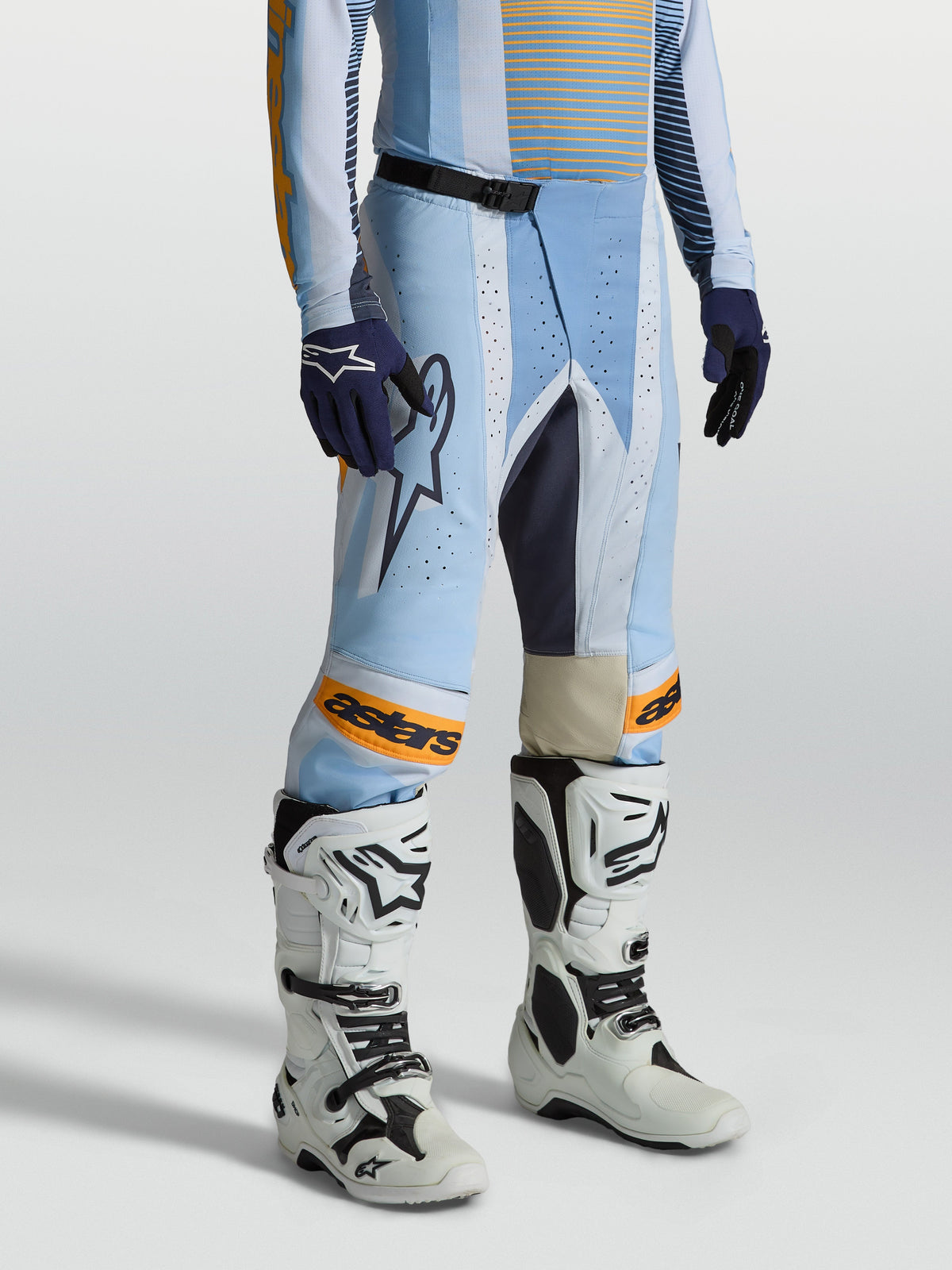 Alpinestars 2027 Techstar Maven Pants, blue and tangerine men's motocross gear with laser perforations and leather panels.