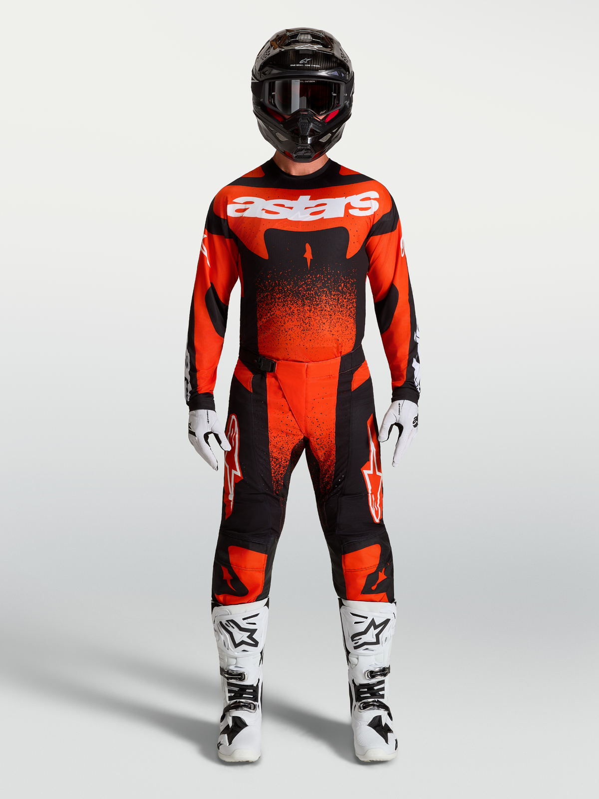Alpinestars Techstar Swan Pants, red and black motocross racing gear with ergonomic fit and reinforced performance panels.