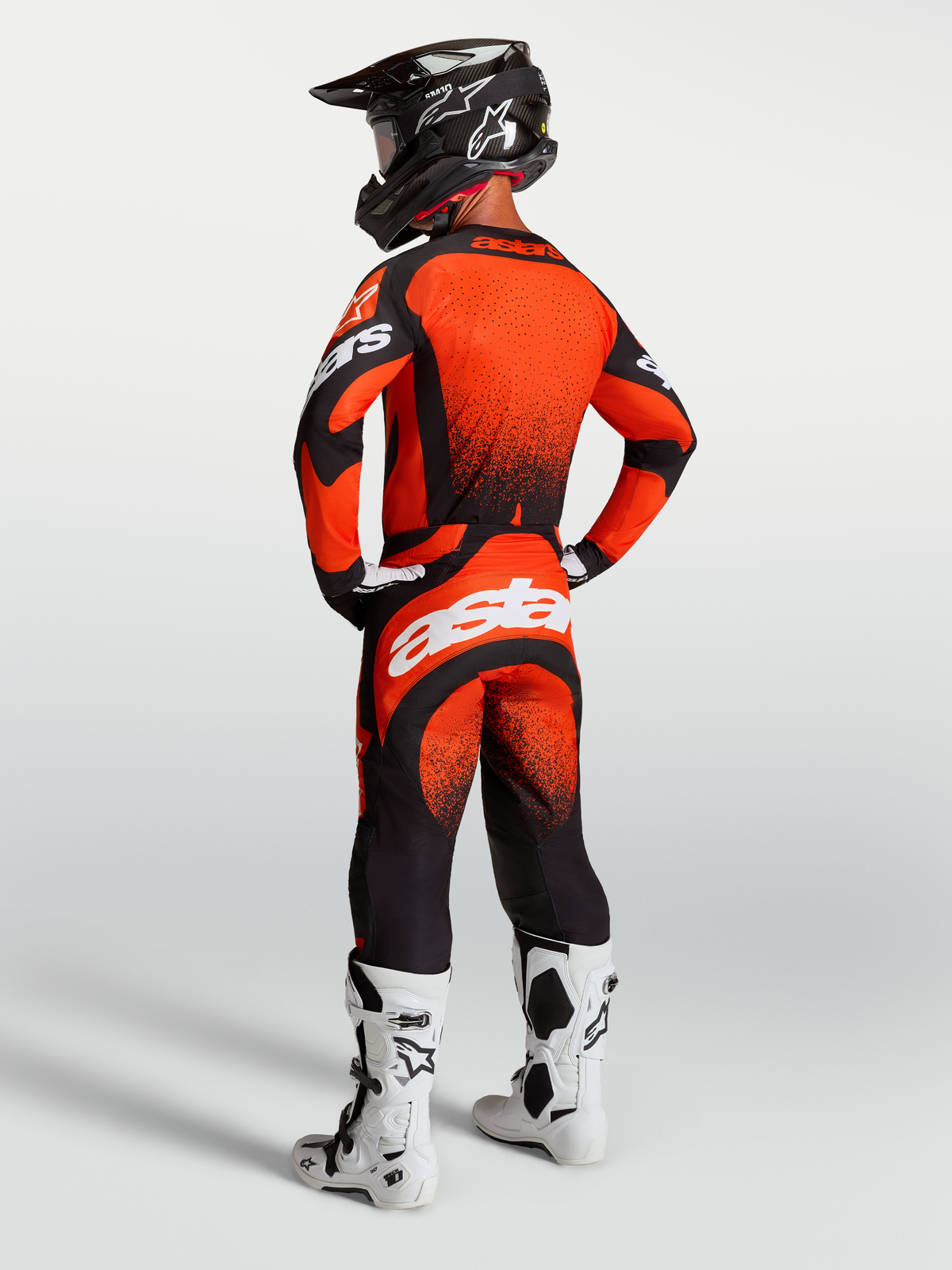 Alpinestars Techstar Swan Pants and Jersey, Motocross racing outfit in Cardinal Red and Black with white branding, rear view.
