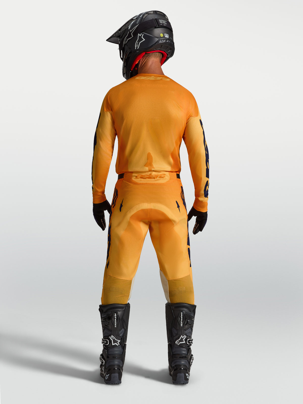 Alpinestars Racer Amber Hose, Motocross-Hose für Herren, Rückansicht, Orange und Dunkelblau, robuste Synthetikkonstruktion.