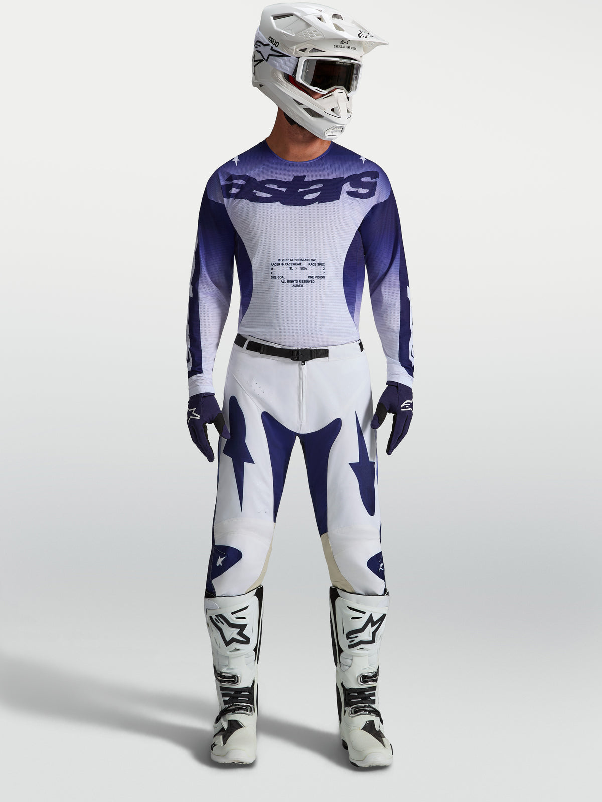Alpinestars Racer Air Amber Hose, blau-weißes Motocross-Ausrüstungsset mit perforiertem Renntrikot und passender Hose.