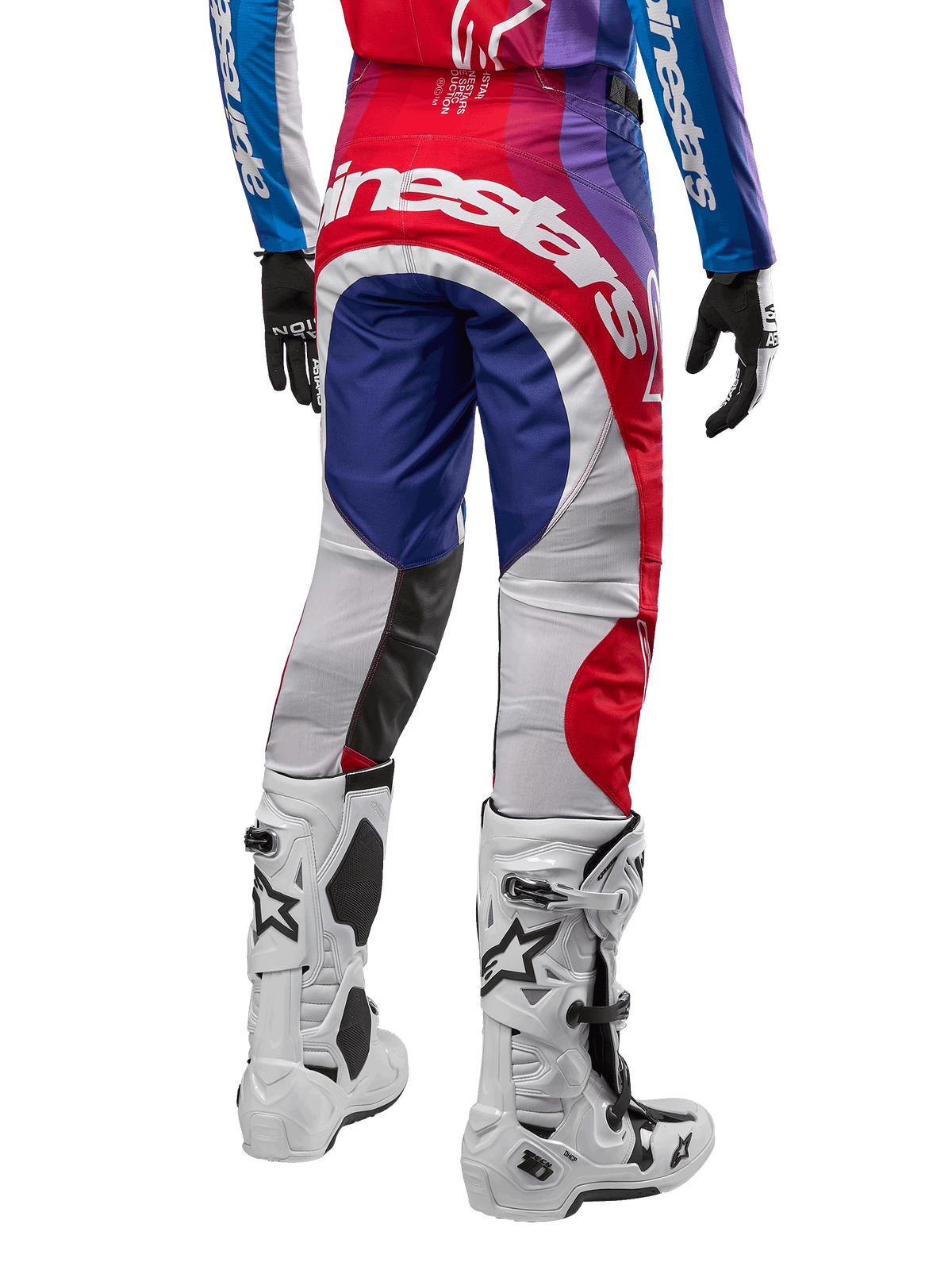 Alpinestars 2024 Techstar Pneuma Pants, Motocross Pants, Blu Mars Red White, rear view worn with matching jersey and white boots, featuring bold white branding on the seat and multi-color paneling, professional motocross racing apparel