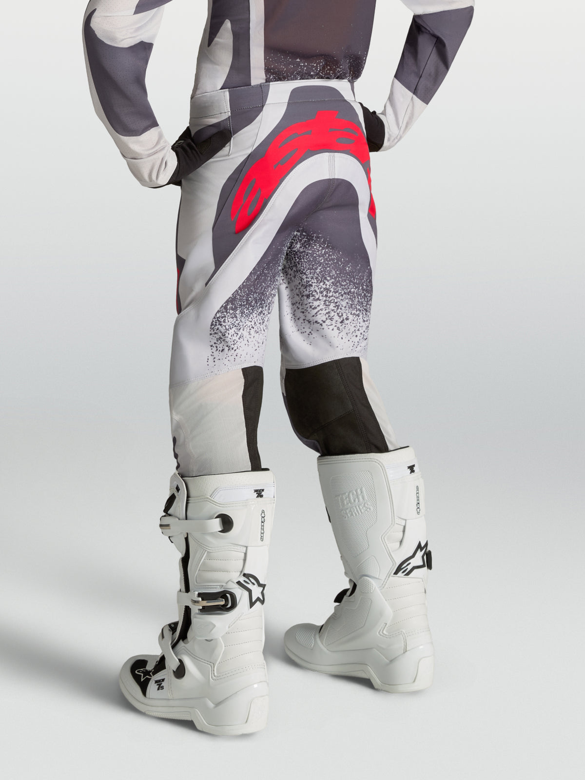 Alpinestars Youth Supertech Swan Pants, youth motocross pants in light lilac and gray with red logo, rear view on-model.