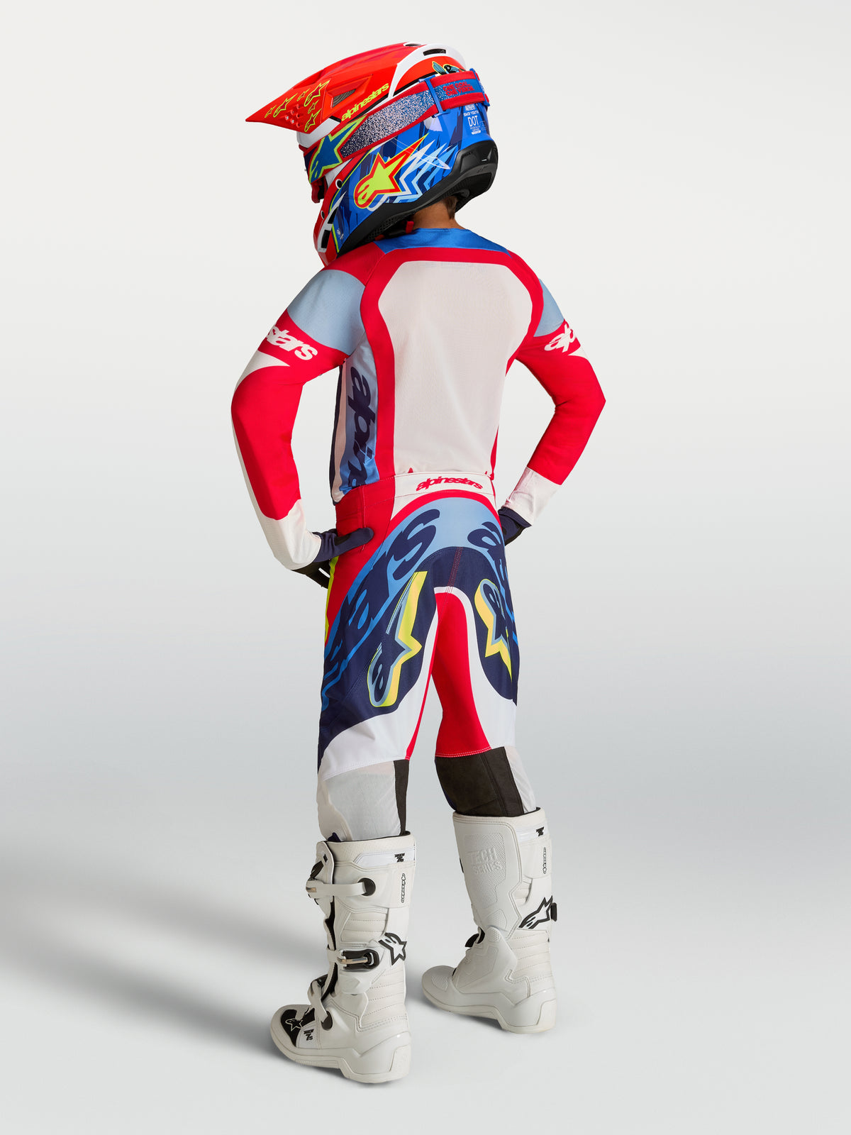 Alpinestars Youth Supertech Dyna Pants, Fire Red and Navy Blue Motocross Racing Gear Set featuring athletic performance.