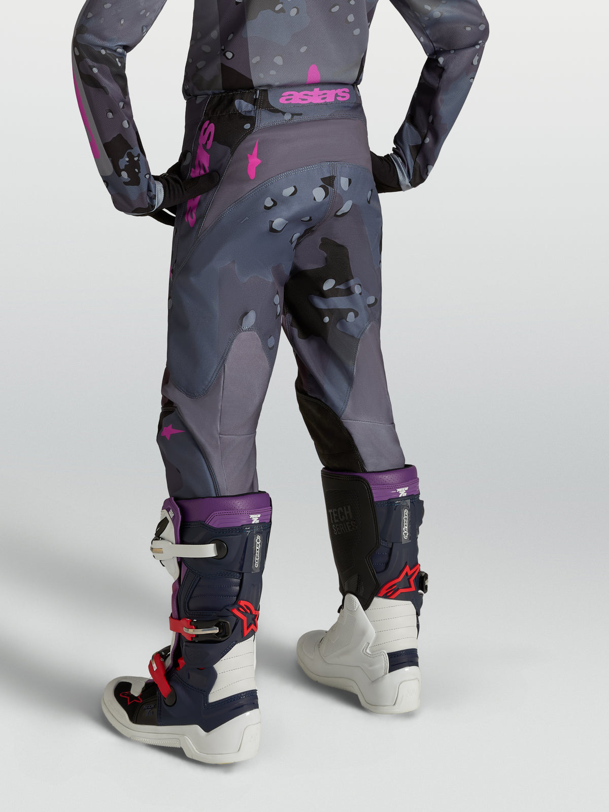 Alpinestars Youth Fluid Lone Pants, gray camo and purple youth motocross pants with ergonomic 3D fit, rear view on model.