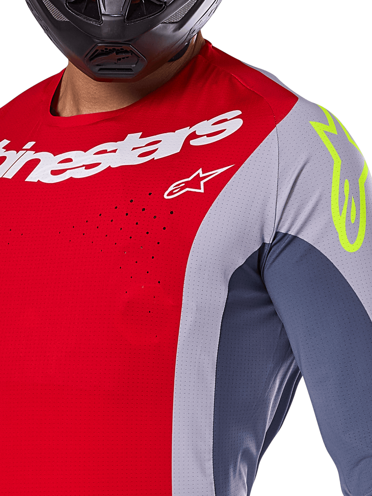 Alpinestars 2025 Techstar Melt Jersey, Motocross Jersey, Bright Red and Gray with dark blue panels, featuring white Alpinestars branding and a neon yellow logo on the shoulder, close-up showing laser-cut ventilation perforations and a black helmet.