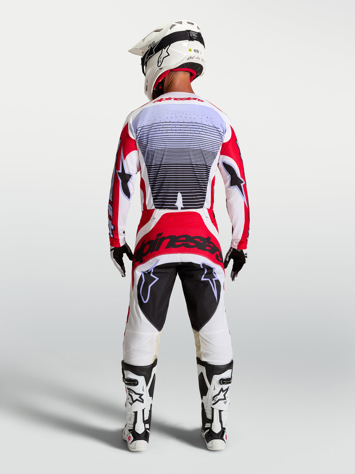 Alpinestars Techstar Maven Motocross-Set, Herren-Renntrikot und -Hose, Feuerrot und Weiß, Rückansicht, athletische Passform.