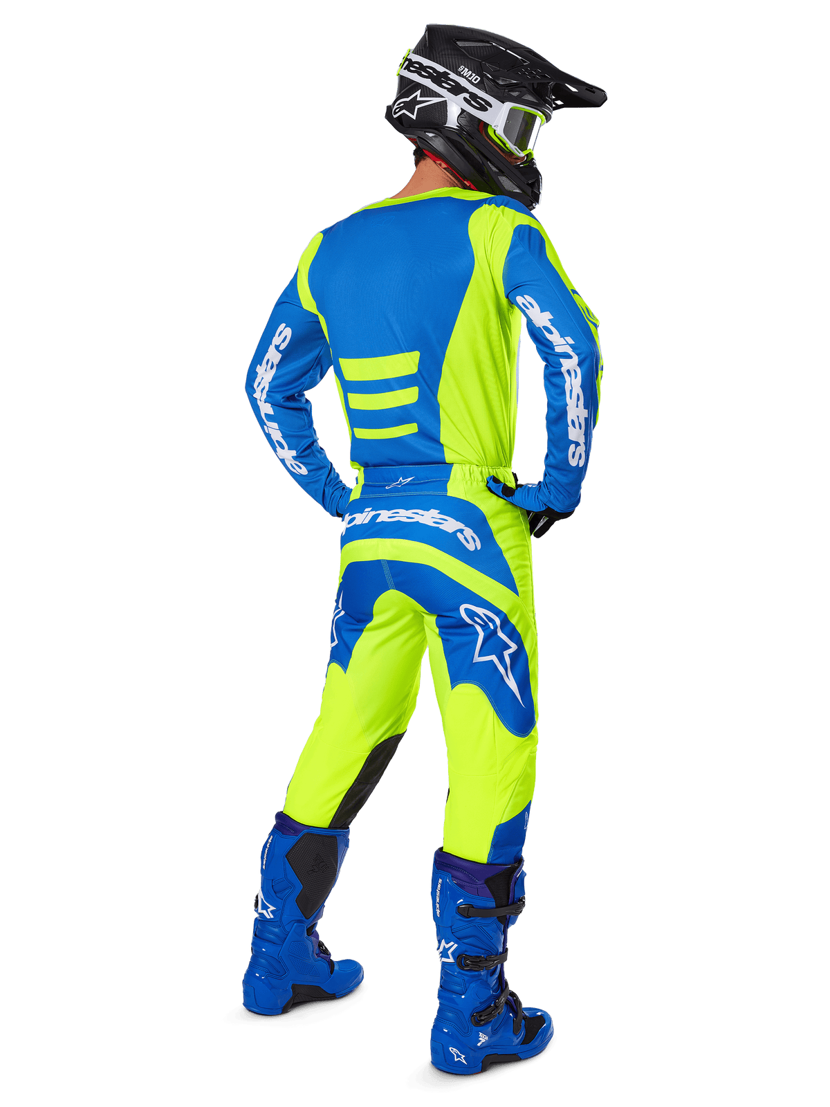 Motocross rider seen from the back wearing the Alpinestars 2025 Fluid Haul Gear Set in Yellow Fluo and Blue, featuring a blue jersey with yellow accents, yellow pants with blue panels on the seat and knees, paired with bright blue boots and a black helmet.