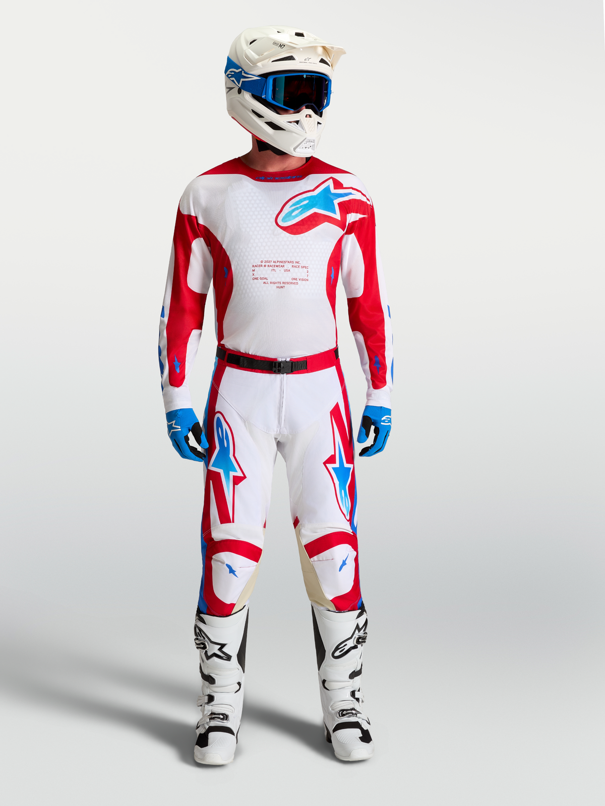 Alpinestars Racer Hunt Jersey, white and red men's motocross gear set with blue accents, matching pants and boots.