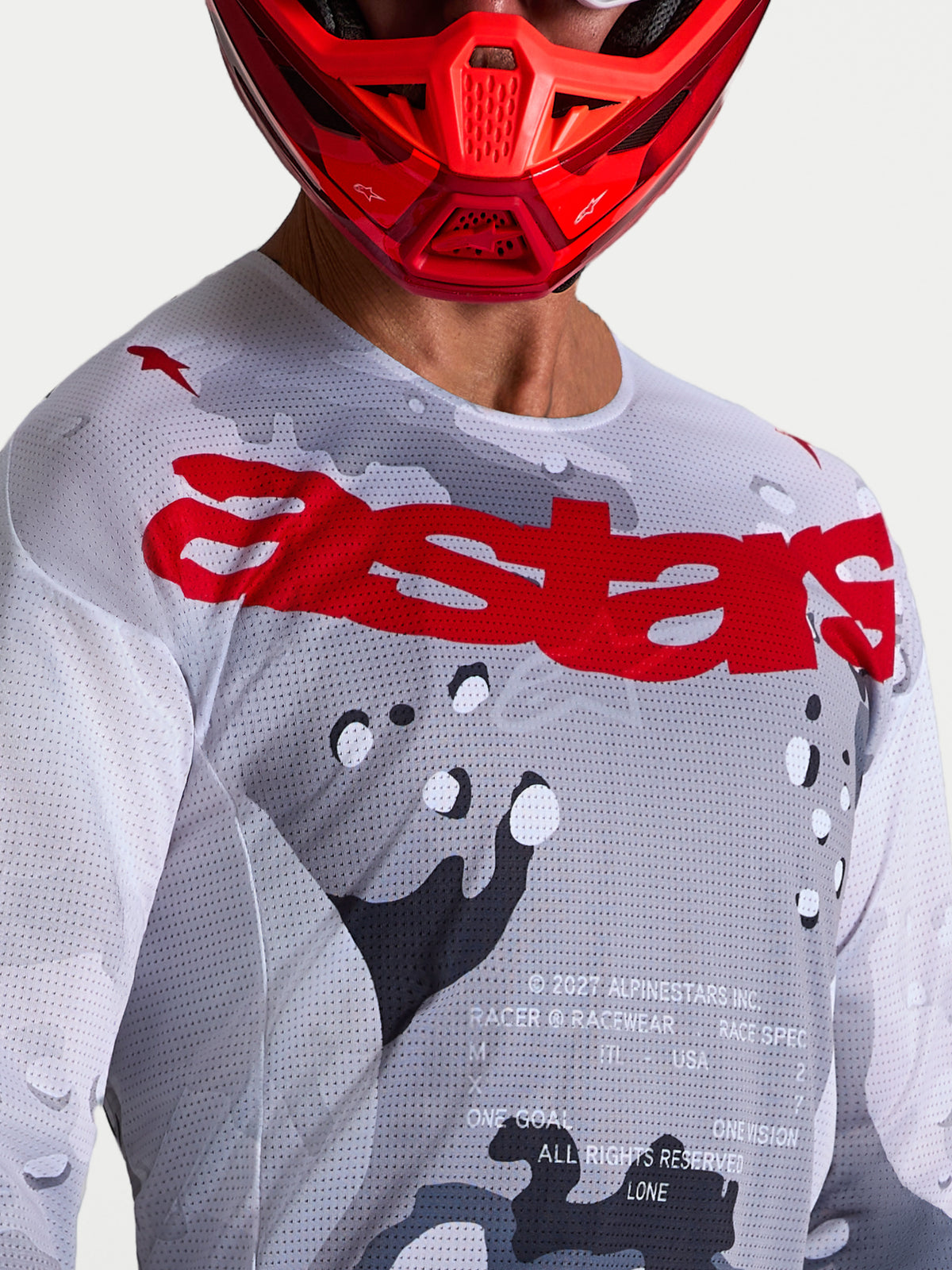 Alpinestars Racer Air Lone Trikot, Motocross-Trikot für Herren, Grau und Rot, belüftete Mesh-Konstruktion, Nahaufnahme.