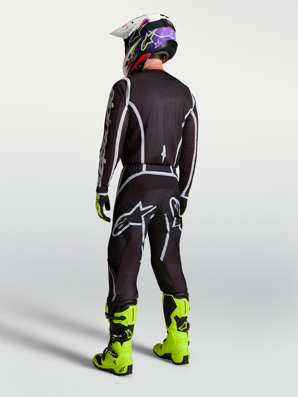 Alpinestars Fluid Apex V2 Trikot für Herren, Motocross-Trikot in Schwarz und Silber, Rückansicht mit sportlicher Passform.