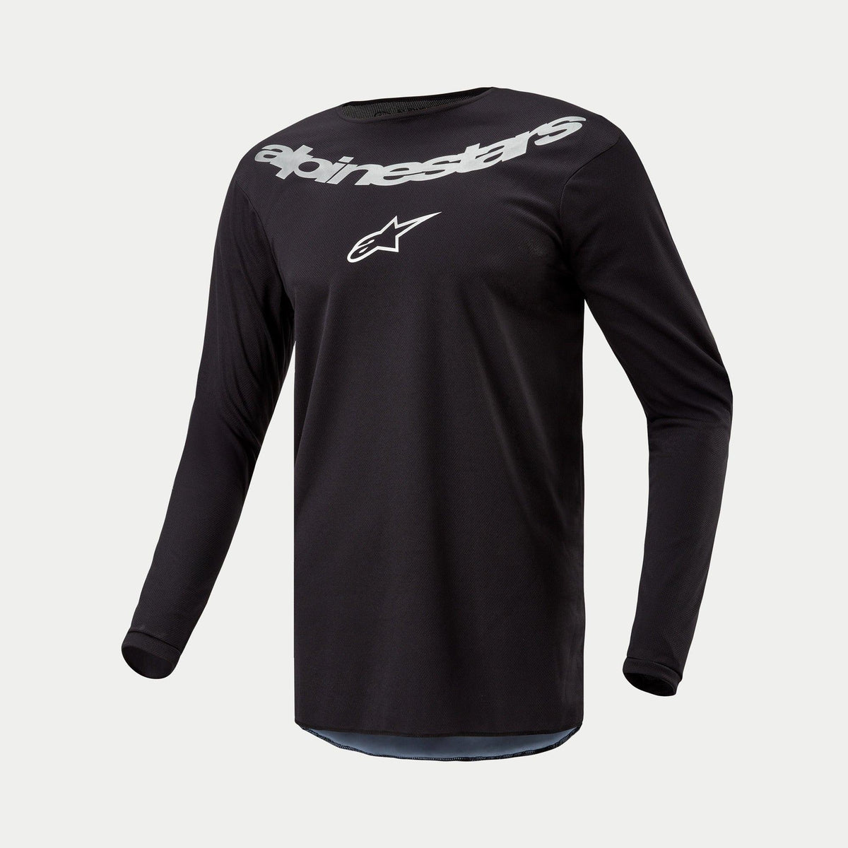 Alpinestars 2024 Fluid Graphite Jersey, Motocross-Trikot, Schwarz Silber, langärmliges Performance-Oberteil mit großem silbernem Alpinestars-Branding und Stern-Logo auf der Brust, leichtes feuchtigkeitsableitendes Poly-Gewebe für den Offroad-Einsatz