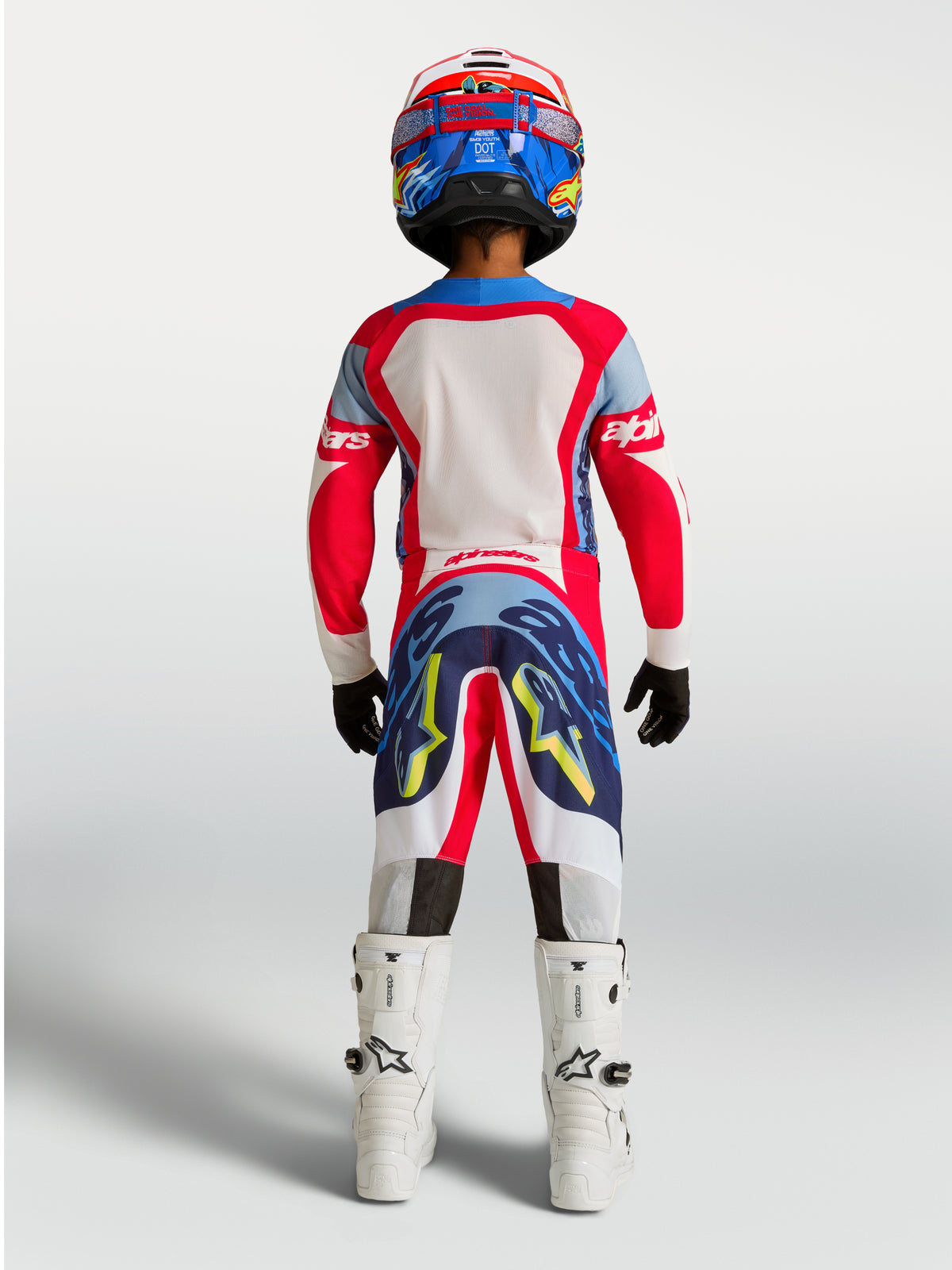 Alpinestars Youth Supertech Dyna Jersey and Gear Set, Fire Red and Navy Blue motocross racing outfit, rear view.