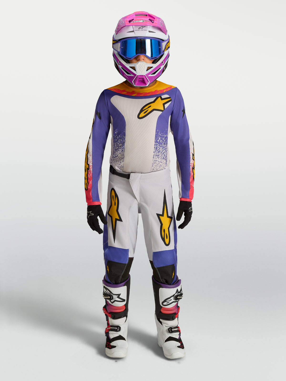 Alpinestars Fluid Jugend-Trikot Drag 2027 und Gear Set, Jugend-Motocross-Outfit, Lila und Weiß mit goldenen Akzenten.