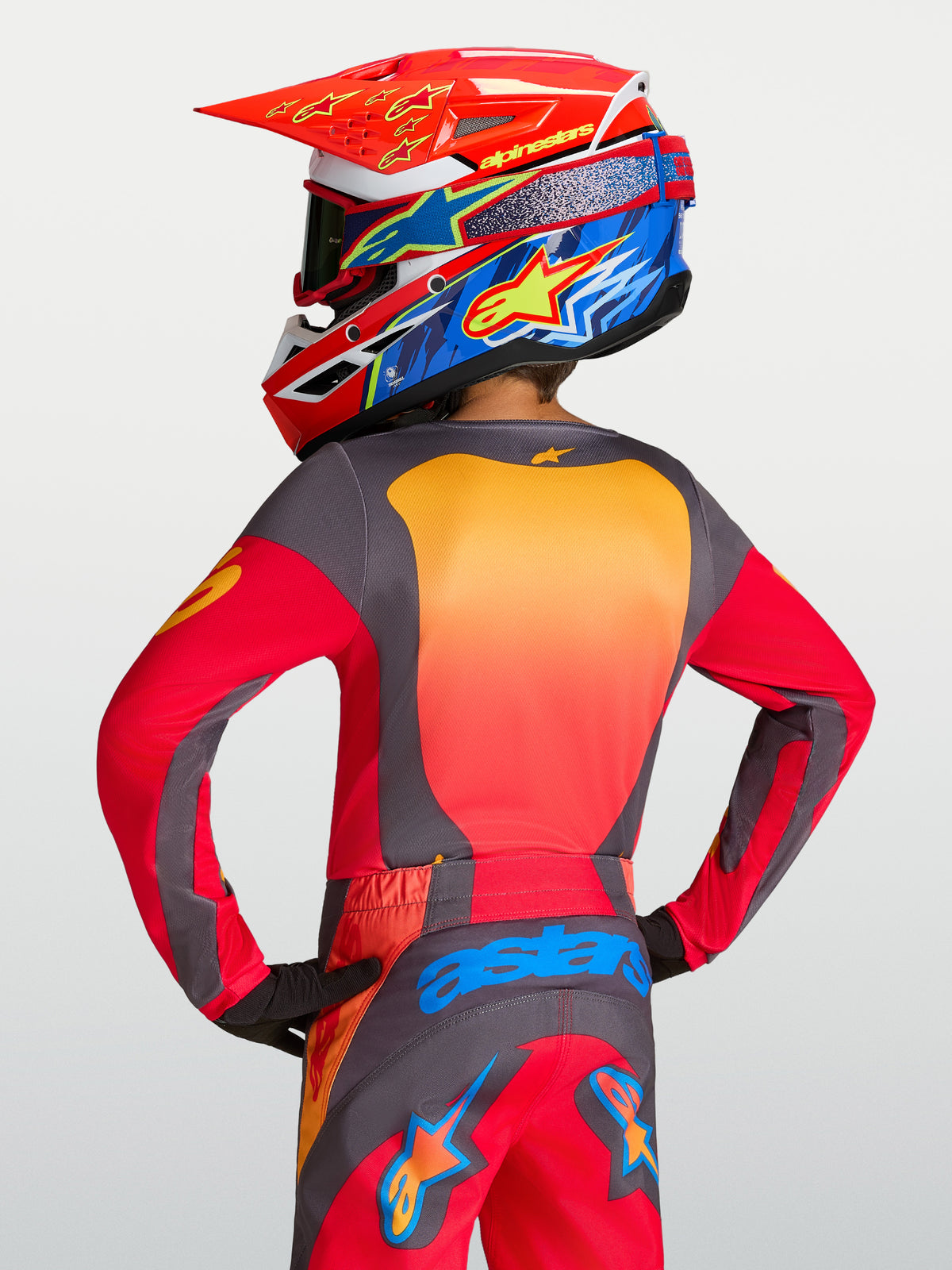 Alpinestars Youth Fluid Hunt Jersey in red and gray, moisture-wicking youth motocross jersey with a relaxed athletic fit.