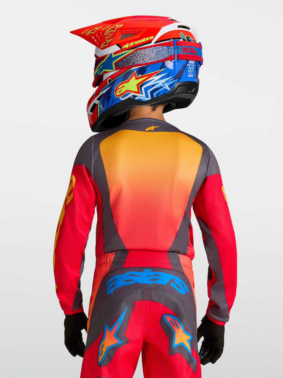 Alpinestars 2027 Youth Fluid Hunt Jersey, Fire Red and Graystone moisture-wicking motocross top for youth riders, rear view.