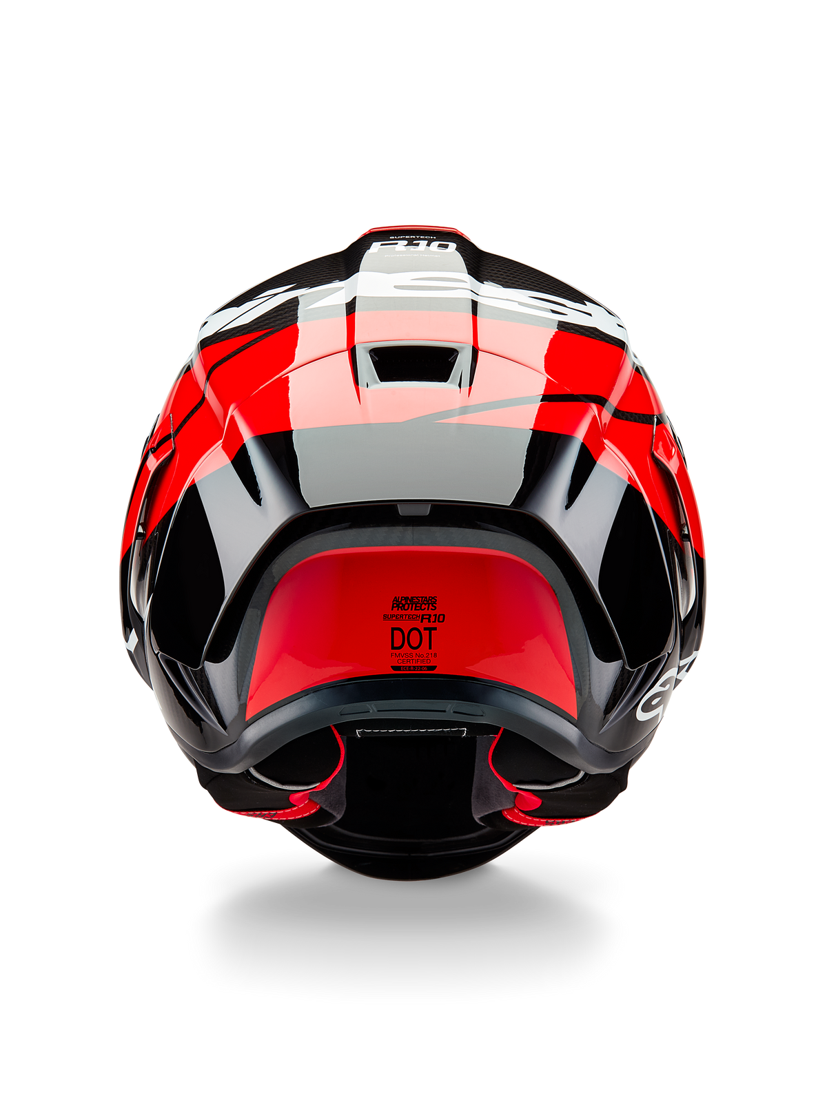 Alpinestars Supertech R10 Element Helm, Rückansicht, Schwarz-Carbon mit leuchtend roten und weißen glänzenden Akzenten, mit aerodynamischem Heckspoiler, Entlüftungsöffnungen und DOT-Zertifizierungslabel, elegantes, vom Rennsport inspiriertes Design mit Carbonfaser-Details