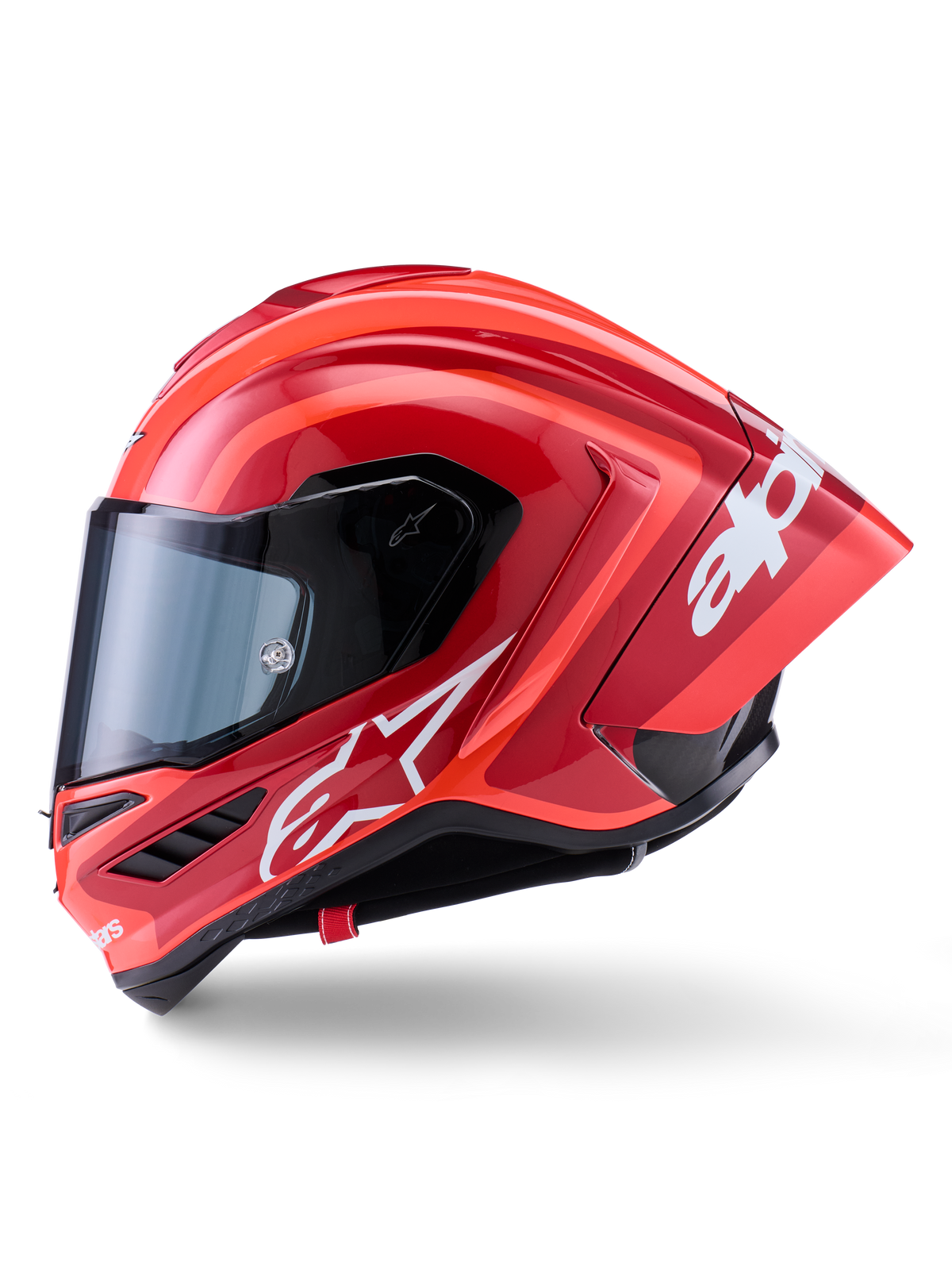 Alpinestars Supertech R10 Arius Helmet, Full-Face Racing Helmet, Glossy Red with white logo graphics, side profile view highlighting aerodynamic spoiler and clear visor, carbon fiber composite shell for professional motorsport