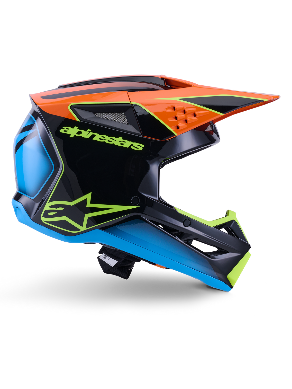 Alpinestars S-M3 Fray Helm ECE 22.06, Motocross-Helm, Schwarz, Orange, Blau und Neongelb, Seitenprofil einer glänzenden aerodynamischen Schale mit markantem orangem Helmschild, neongrünem Branding und blauen Akzenten, Offroad-Rennschutz