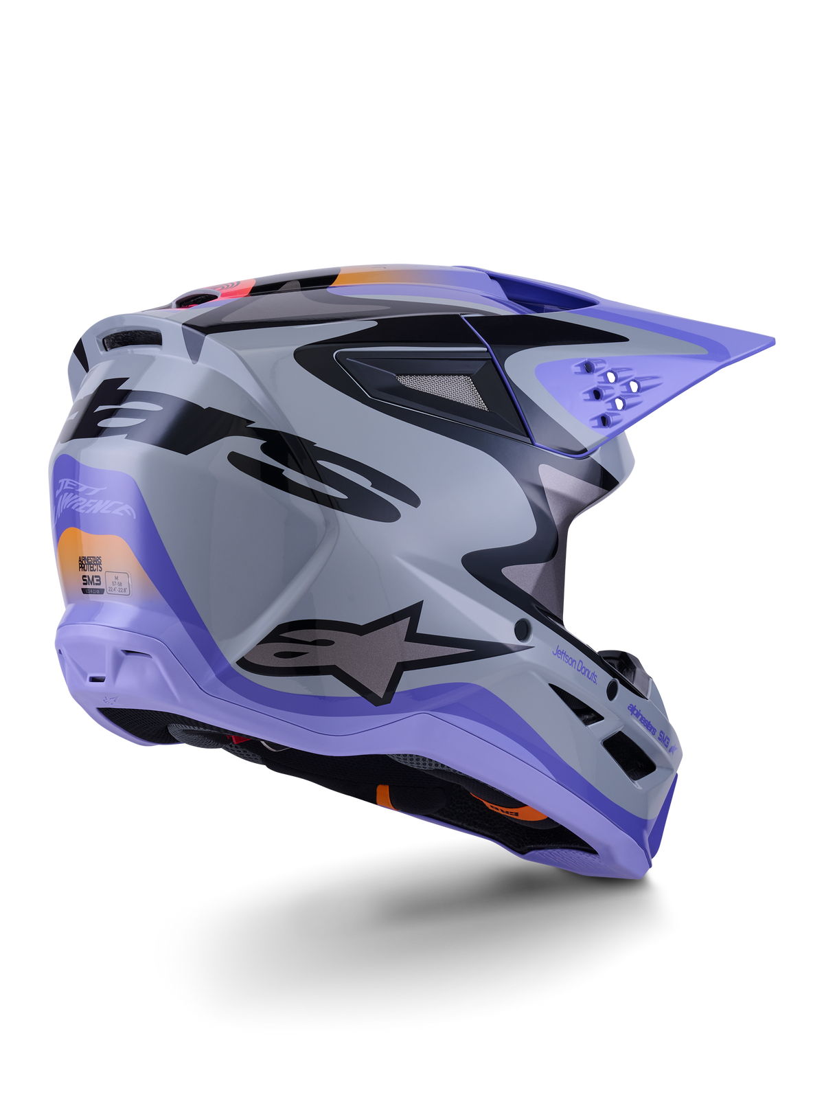 Alpinestars S-M3 Jettson Helm ECE 22.06, Motocross-Helm, Grau, Violett und Schwarz glänzend, Dreiviertelansicht von hinten zeigt die aerodynamische thermo-injizierte Schale mit Belüftungsöffnungen und markantem Grafikdesign